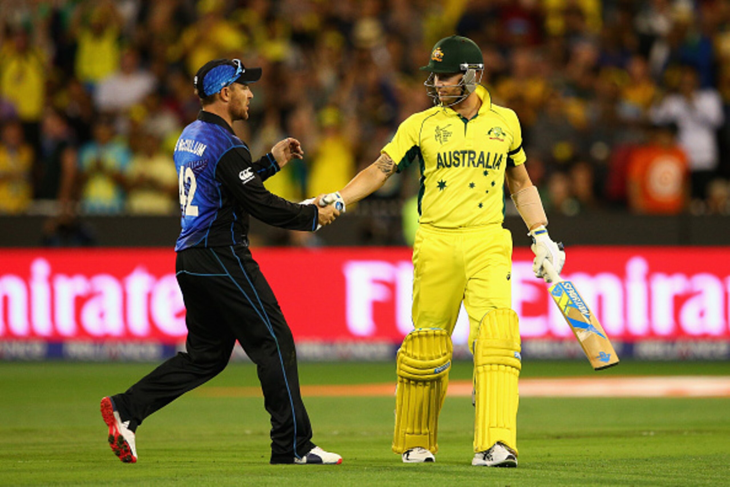 MELBOURNE, AUSTRALIA - MARCH 29: New Zealand captain Brendon McCullum shakes hands with Michael Clarke of Australia after he was dismissed by Matt Henry of New Zealand during the 2015 ICC Cricket World Cup final match between Australia and New Zealand at 