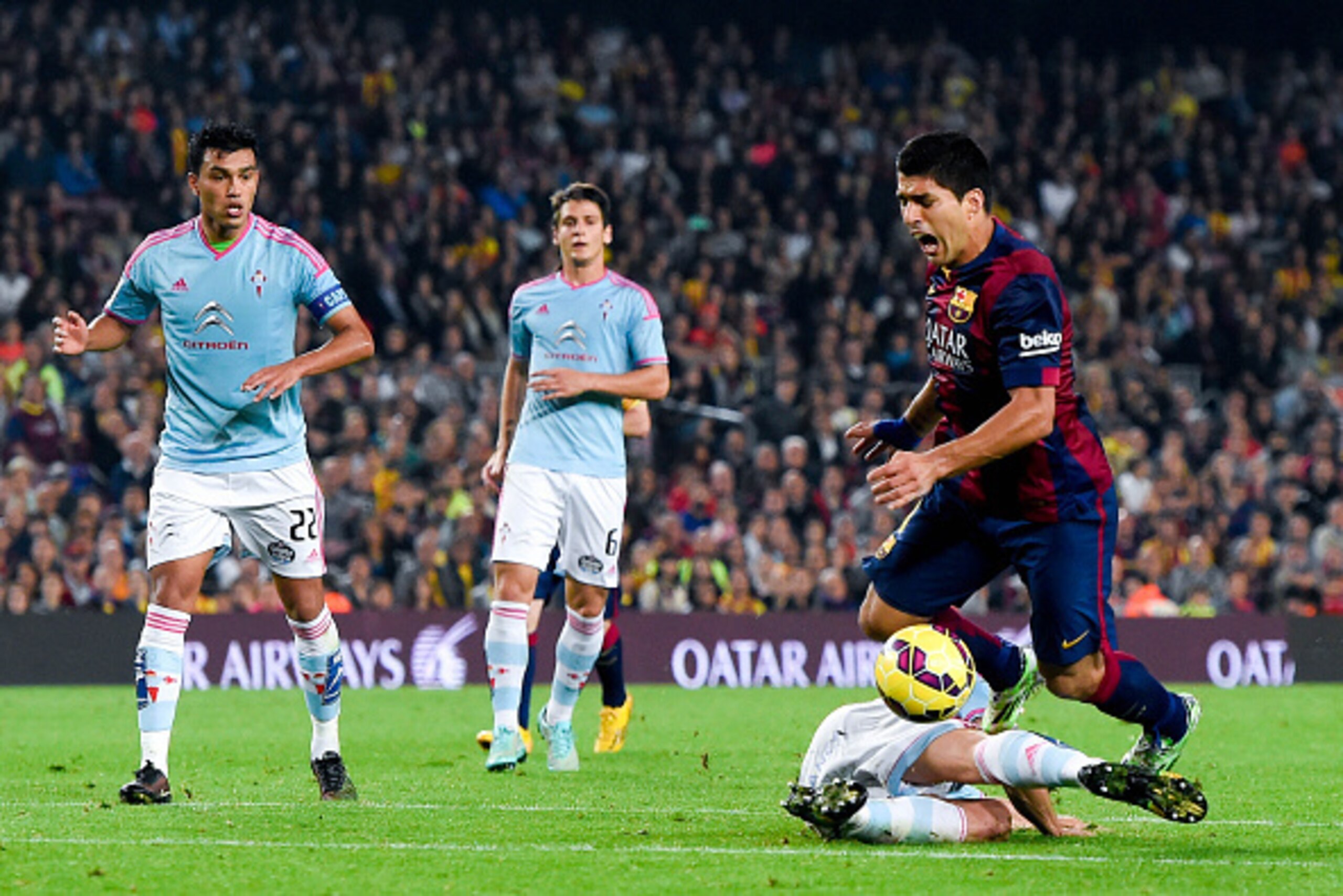 BARCELONA, SPAIN - NOVEMBER 01: Luis Suarez of FC Barcelona is brought down by Sergi Gomez of Celta de Vigo during the La Liga match between FC Barcelona and Celta de Vigo at Camp Nou on November 1, 2014 in Barcelona, Spain. (Photo by David Ramos/Getty BARCELONA, SPAIN - NOVEMBER 01: Luis Suarez of FC Barcelona is brought down by Sergi Gomez of Celta de Vigo during the La Liga match between FC Barcelona and Celta de Vigo at Camp Nou on November 1, 2014 in Barcelona, Spain. (Photo by David Ramos/Getty