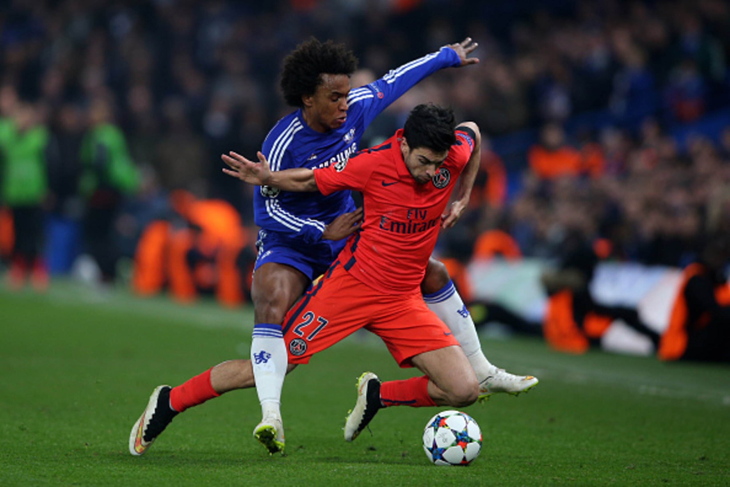 LONDON, ENGLAND - MARCH 11:  Javier Pastore of PSG is brought down by Willian of Chelsea during the UEFA Champions League Round of 16, second leg match between Chelsea and Paris Saint-Germain at Stamford Bridge on March 11, 2015 in London, England.  (Phot