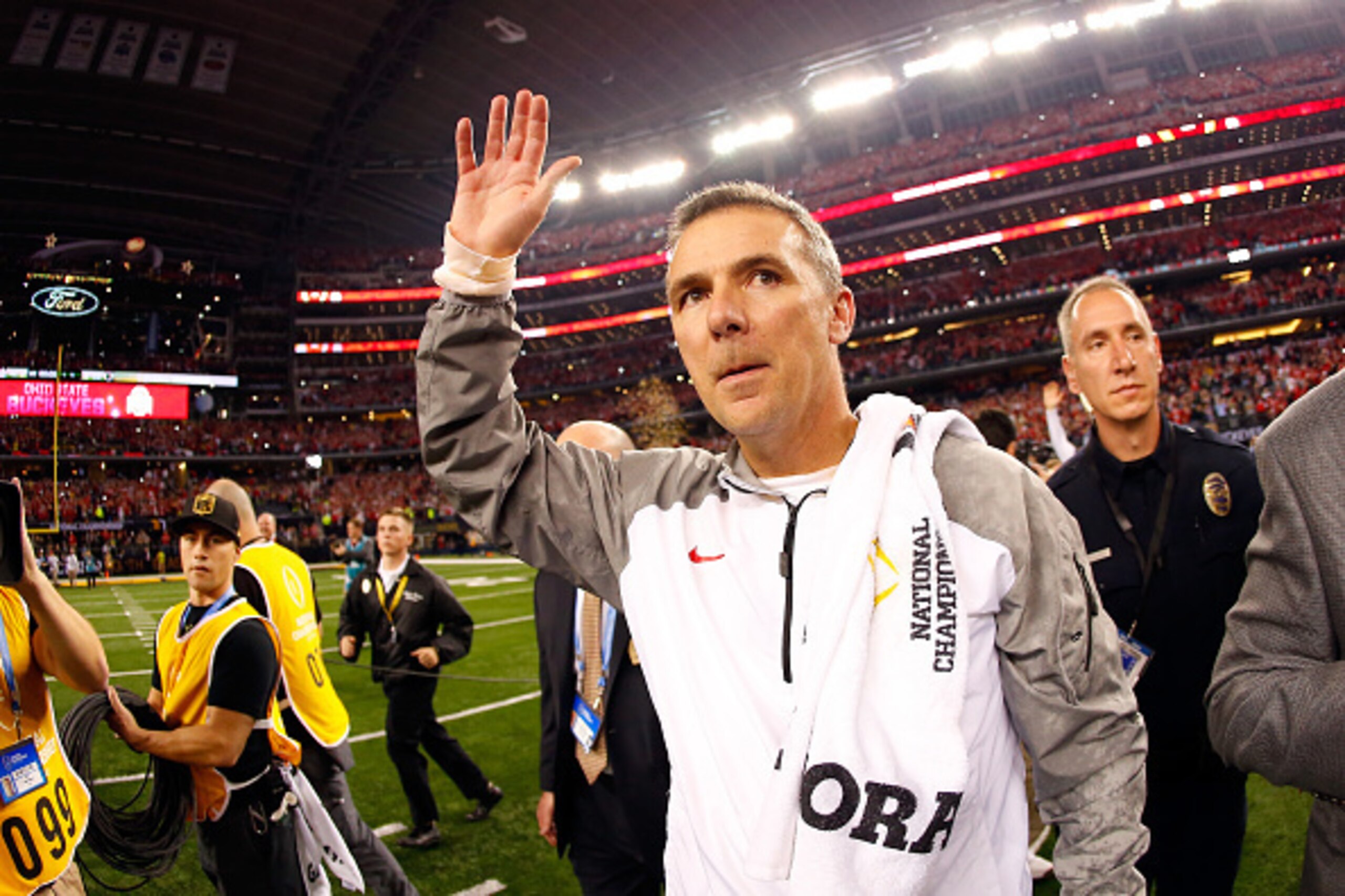 ARLINGTON, TX - JANUARY 12:  (L-R) Head Coach Urban Meyer of the Ohio State Buckeyes celebrates after defeating the Oregon Ducks 42 to 20 in the College Football Playoff National Championship Game at AT&T Stadium on January 12, 2015 in Arlington, Texas.  