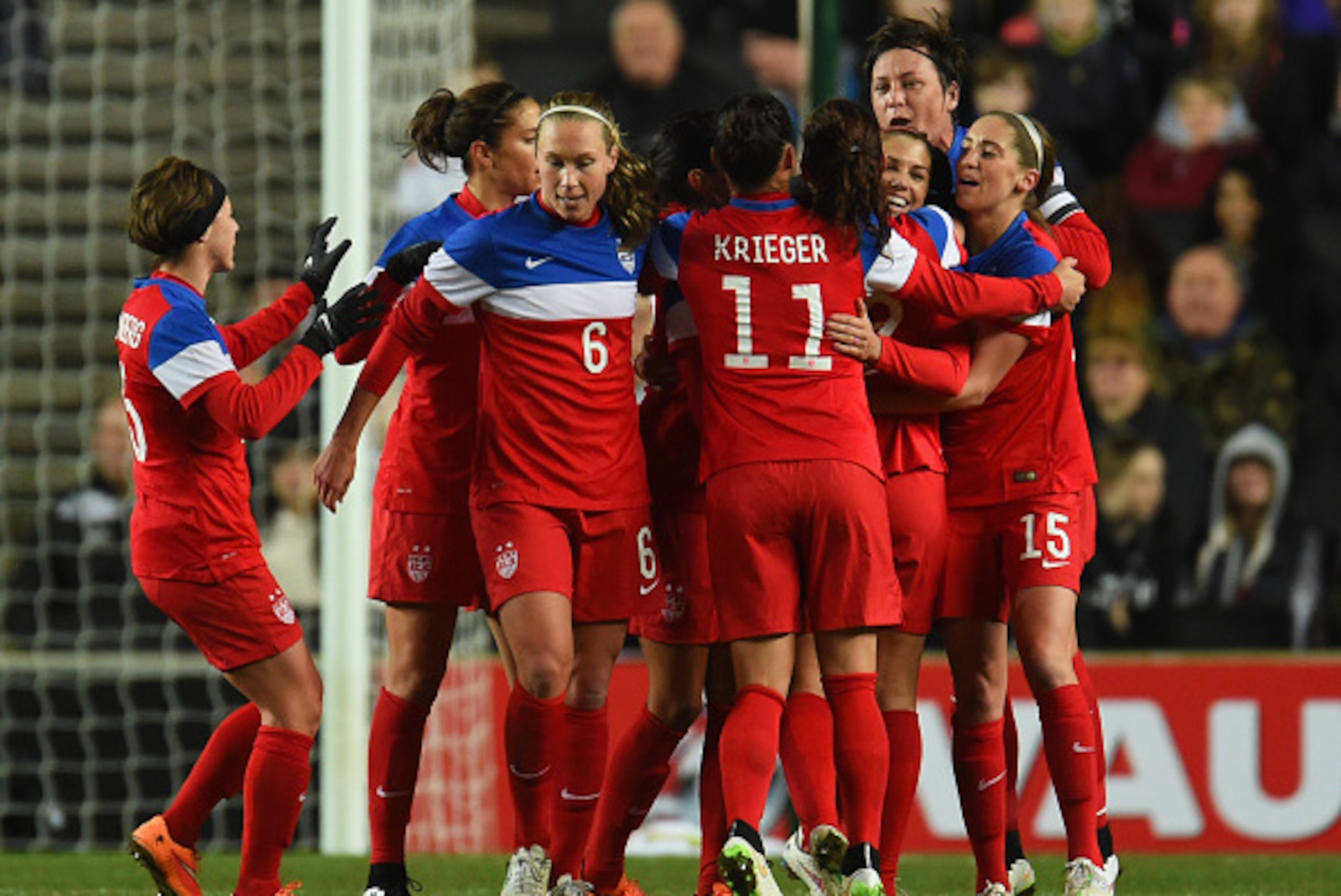 MILTON KEYNES, ENGLAND - FEBRUARY 13:  Alex Morgan of the United States (3R) celebrates with team mates as she scores their first goal during the Women's Friendly International match between England and USA at Stadium mk on February 13, 2015 in Milton Key
