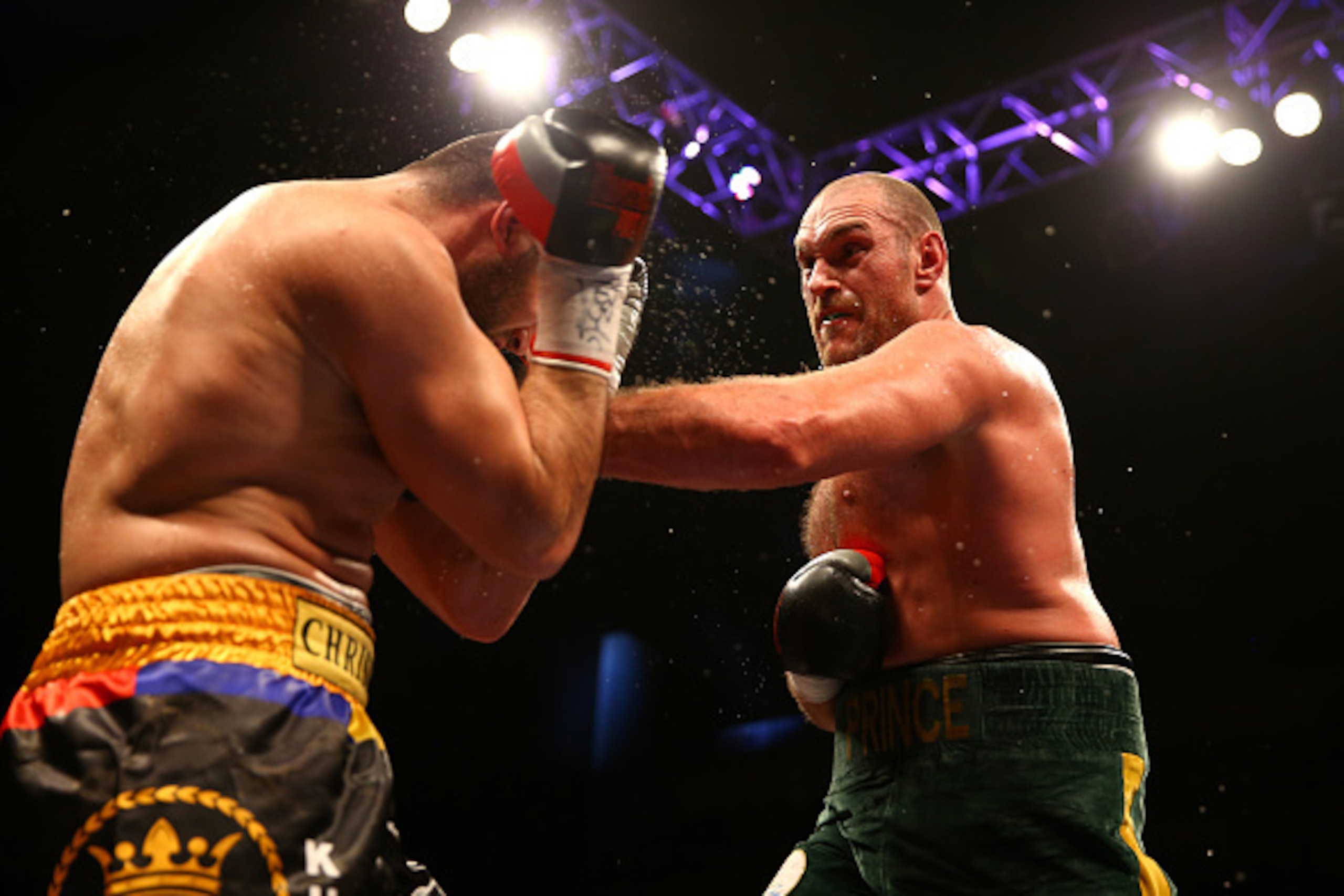 LONDON, ENGLAND - FEBRUARY 28:  Tyson Fury (green shorts) on his way to victory over Christian Hammer in a Heavyweight Contest by singing 'Elvis' at the O2 Arena on February 28, 2015 in London, England.  (Photo by Richard Heathcote/Getty Images)