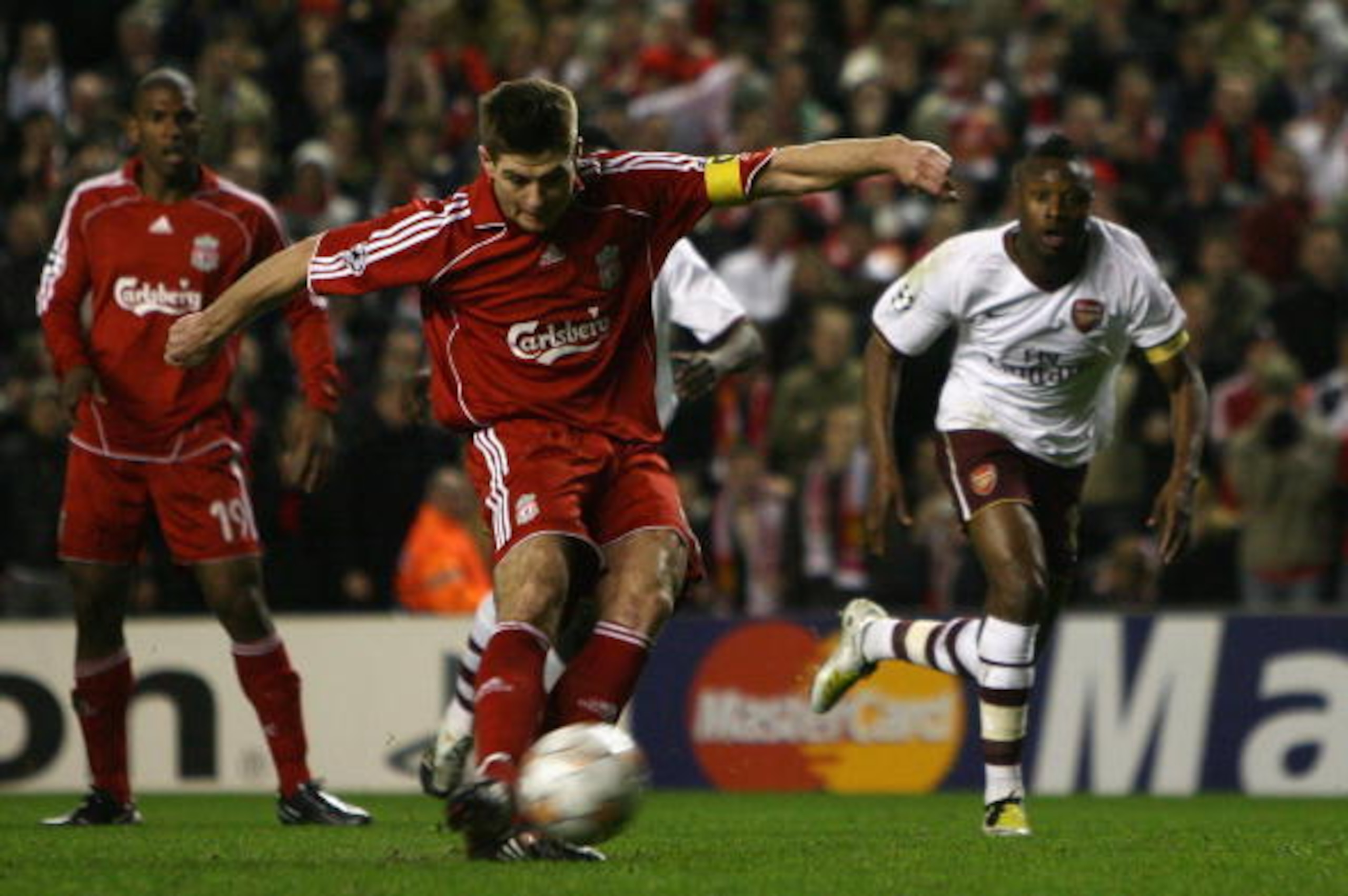 LIVERPOOL, UNITED KINGDOM - APRIL 8: Steven Gerrard of Liverpool scores his team's third goal from the penalty spot during the UEFA Champions League Quarter Final, second leg match between Liverpool and Arsenal at Anfield on April 8, 2008 in Liverpool, E LIVERPOOL, UNITED KINGDOM - APRIL 8: Steven Gerrard of Liverpool scores his team's third goal from the penalty spot during the UEFA Champions League Quarter Final, second leg match between Liverpool and Arsenal at Anfield on April 8, 2008 in Liverpool, E