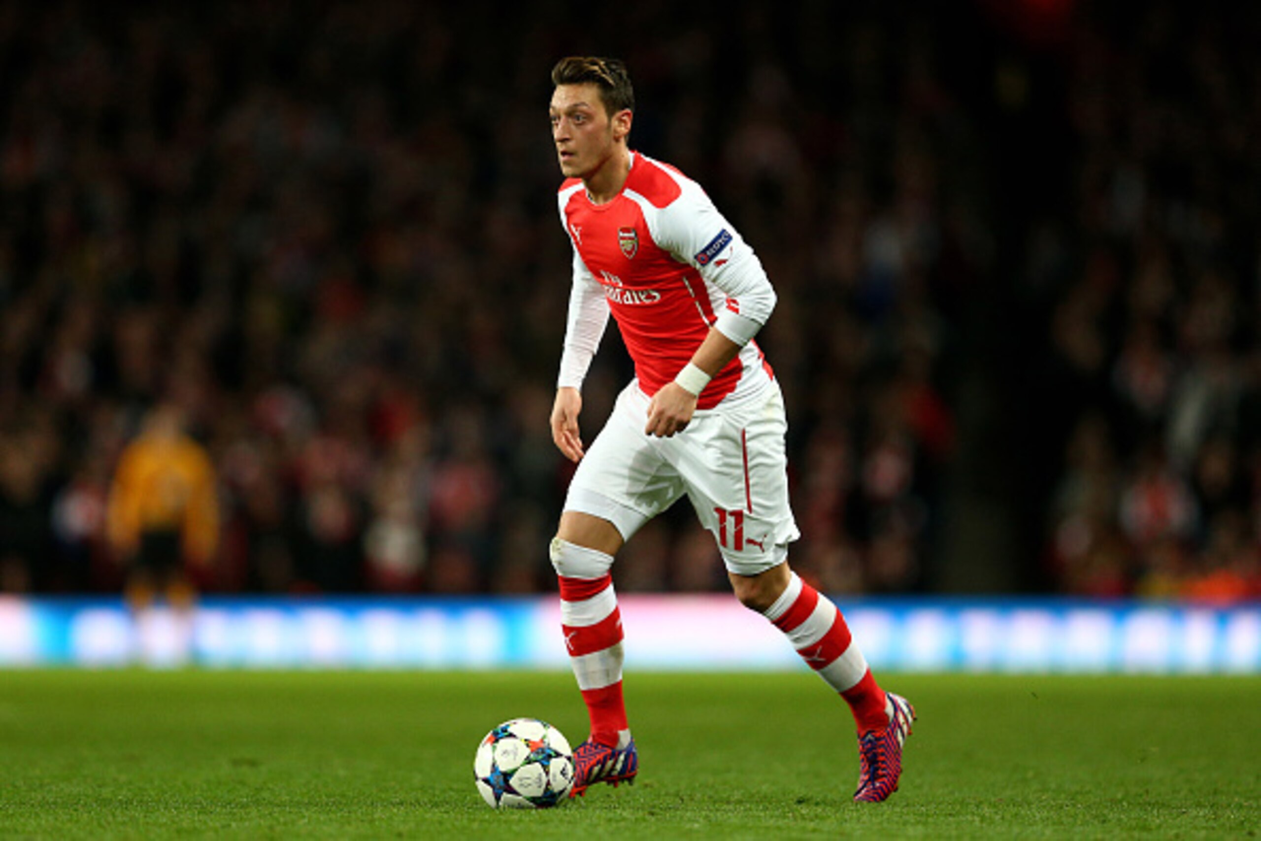 LONDON, ENGLAND - FEBRUARY 25: Mesut Oezil of Arsenal runs with the ball during the UEFA Champions League round of 16, first leg match between Arsenal and Monaco at The Emirates Stadium on February 25, 2015 in London, United Kingdom. (Photo by Clive Mas LONDON, ENGLAND - FEBRUARY 25: Mesut Oezil of Arsenal runs with the ball during the UEFA Champions League round of 16, first leg match between Arsenal and Monaco at The Emirates Stadium on February 25, 2015 in London, United Kingdom. (Photo by Clive Mas
