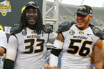 ORLANDO, FL - JANUARY 01:  Head coach Gary Pinkel of the Missouri Tigers, Shane Ray #56, and Markus Golden #33 celebrate following the Buffalo Wild Wings Citrus Bowl at the Florida Citrus Bowl on January 1, 2015 in Orlando, Florida. The Missouri Tigers de