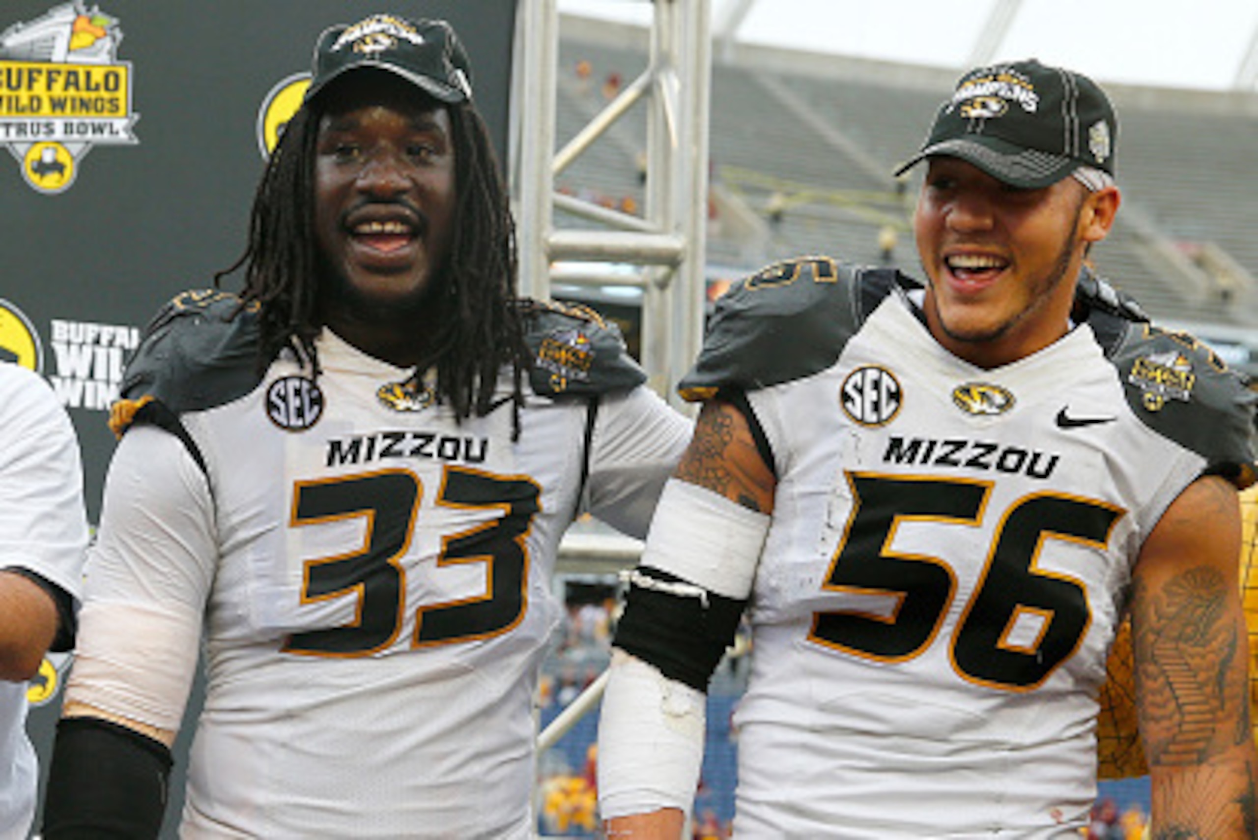 ORLANDO, FL - JANUARY 01:  Head coach Gary Pinkel of the Missouri Tigers, Shane Ray #56, and Markus Golden #33 celebrate following the Buffalo Wild Wings Citrus Bowl at the Florida Citrus Bowl on January 1, 2015 in Orlando, Florida. The Missouri Tigers de