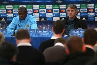 MANCHESTER, ENGLAND - OCTOBER 02:  Yaya Toure of Manchester City and Roberto Mancini the manager of Manchester City face the media during a press conference at the Carrington Training Ground on October 2, 2012 in Manchester, England.  (Photo by Alex Lives