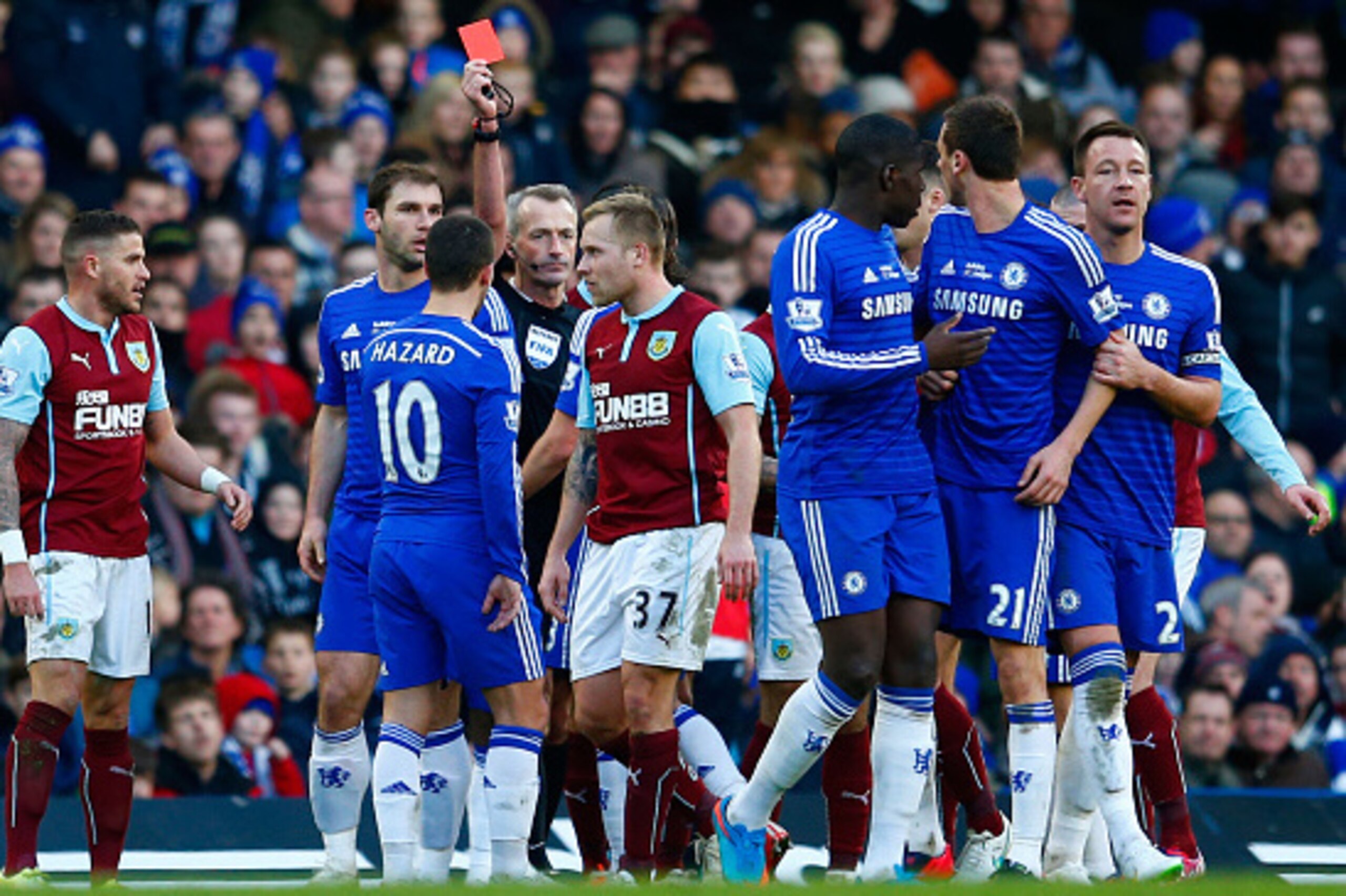 LONDON, ENGLAND - FEBRUARY 21: Referee Martin Atkinson shows the red card to Nemanja Matic of Chelsea for his reaction to the tackle by Ashley Barnes of Burnley during the Barclays Premier League match between Chelsea and Burnley at Stamford Bridge on Fe LONDON, ENGLAND - FEBRUARY 21: Referee Martin Atkinson shows the red card to Nemanja Matic of Chelsea for his reaction to the tackle by Ashley Barnes of Burnley during the Barclays Premier League match between Chelsea and Burnley at Stamford Bridge on Fe
