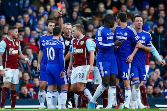 LONDON, ENGLAND - FEBRUARY 21: Referee Martin Atkinson shows the red card to Nemanja Matic of Chelsea for his reaction to the tackle by Ashley Barnes of Burnley during the Barclays Premier League match between Chelsea and Burnley at Stamford Bridge on Fe LONDON, ENGLAND - FEBRUARY 21: Referee Martin Atkinson shows the red card to Nemanja Matic of Chelsea for his reaction to the tackle by Ashley Barnes of Burnley during the Barclays Premier League match between Chelsea and Burnley at Stamford Bridge on Fe