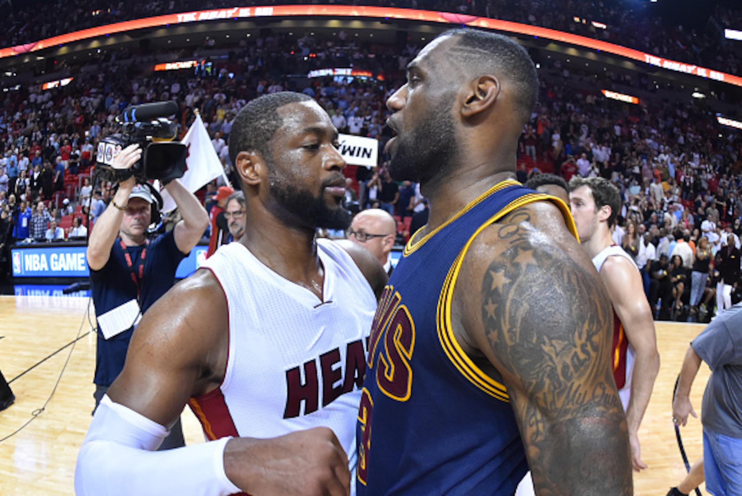 MIAMI - MARCH 16: LeBron James #23 of Cleveland Cavaliers greets former teammates after the game against Dwyane Wade #3 of the Miami Heat at the American Airlines Arena on March 16, 2015 in Miami , Florida. NOTE TO USER: User expressly acknowledges and MIAMI - MARCH 16: LeBron James #23 of Cleveland Cavaliers greets former teammates after the game against Dwyane Wade #3 of the Miami Heat at the American Airlines Arena on March 16, 2015 in Miami , Florida. NOTE TO USER: User expressly acknowledges and