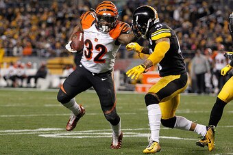 PITTSBURGH, PA - DECEMBER 28:  Jeremy Hill #32 of the Cincinnati Bengals carries the ball in front of Antwon Blake #41 of the Pittsburgh Steelers during the third quarter at Heinz Field on December 28, 2014 in Pittsburgh, Pennsylvania.  (Photo by Justin K