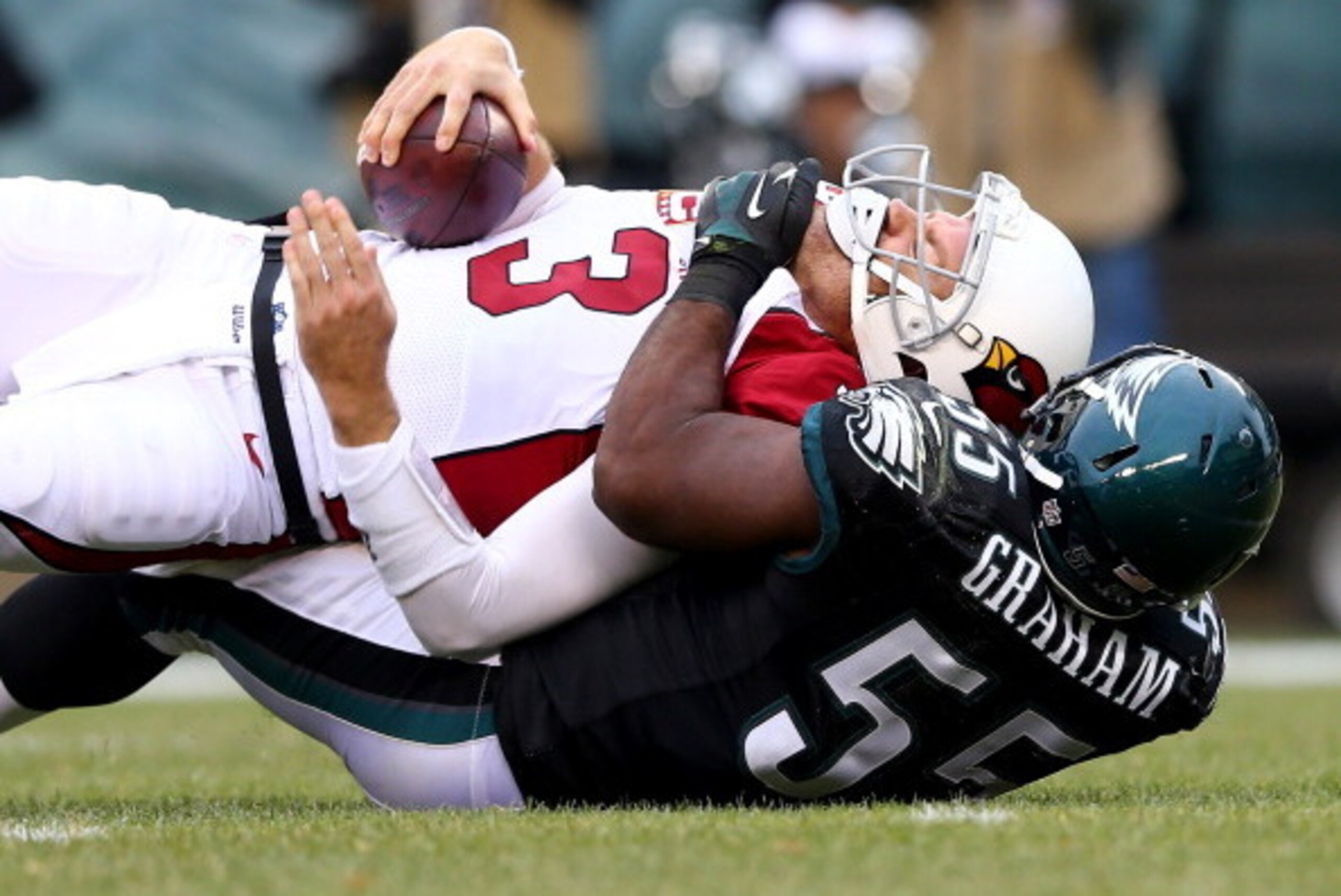 PHILADELPHIA, PA - DECEMBER 01:  Carson Palmer #3 of the Arizona Cardinals is sacked by Brandon Graham #55 of the Philadelphia Eagles on December 1, 2013 at Lincoln Financial Field in Philadelphia, Pennslyvania.The Philadelphia Eagles defeated the Arizona