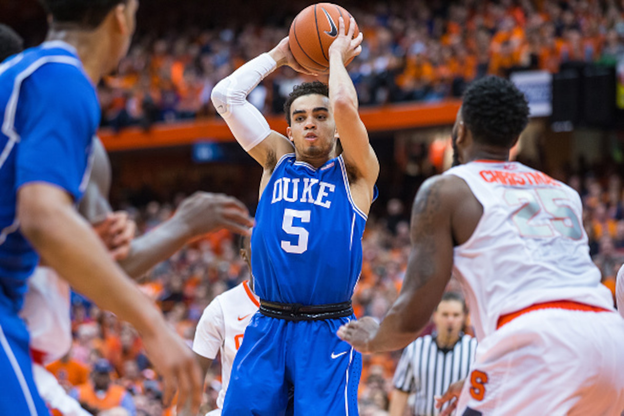 SYRACUSE, NY - FEBRUARY 14:  Tyus Jones #5 of the Duke Blue Devils looks to pass the ball during the second half against the Syracuse Orange on February 14, 2015 at The Carrier Dome in Syracuse, New York.  Duke defeats Syracuse 80-72.  (Photo by Brett Car