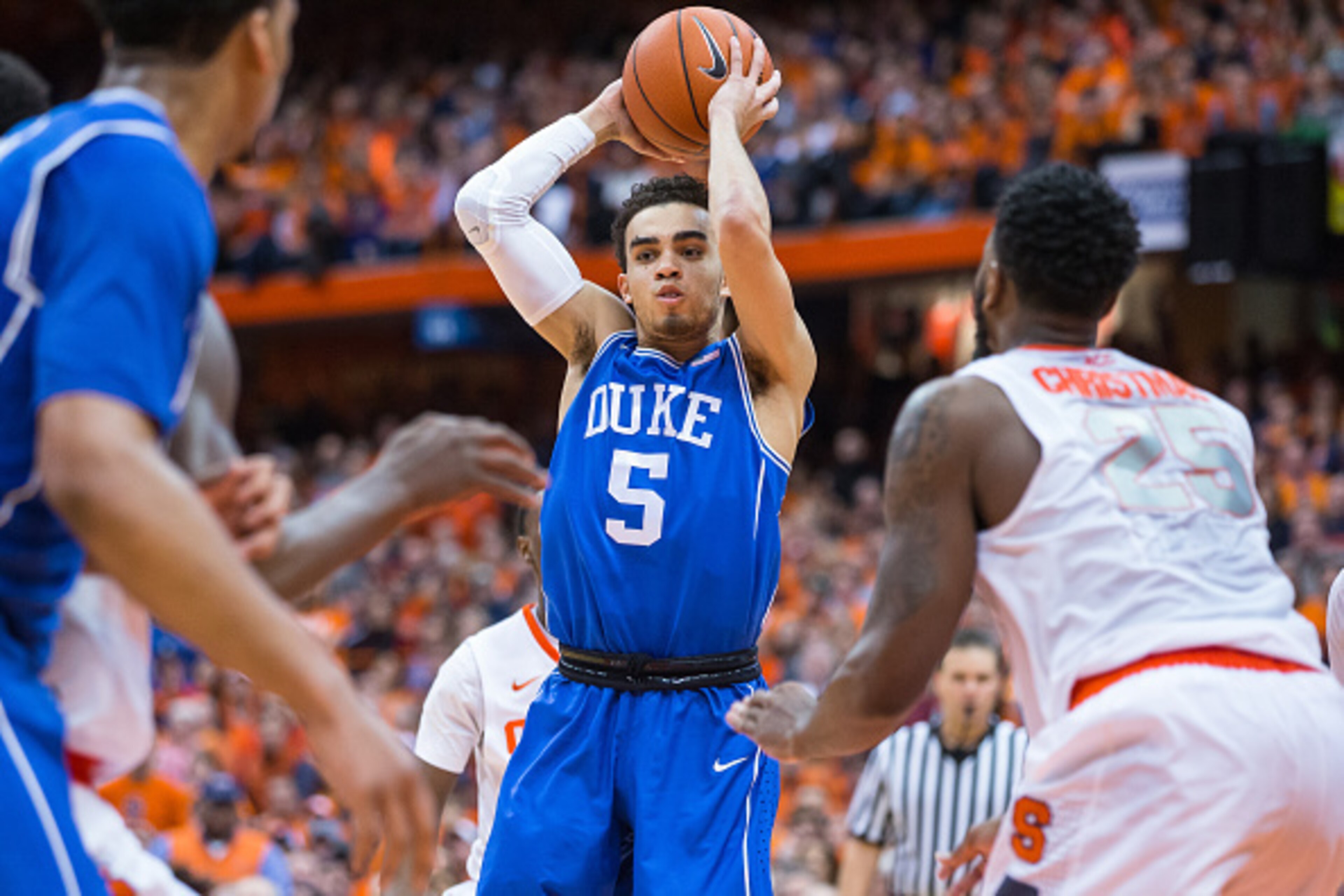 SYRACUSE, NY - FEBRUARY 14:  Tyus Jones #5 of the Duke Blue Devils looks to pass the ball during the second half against the Syracuse Orange on February 14, 2015 at The Carrier Dome in Syracuse, New York.  Duke defeats Syracuse 80-72.  (Photo by Brett Car