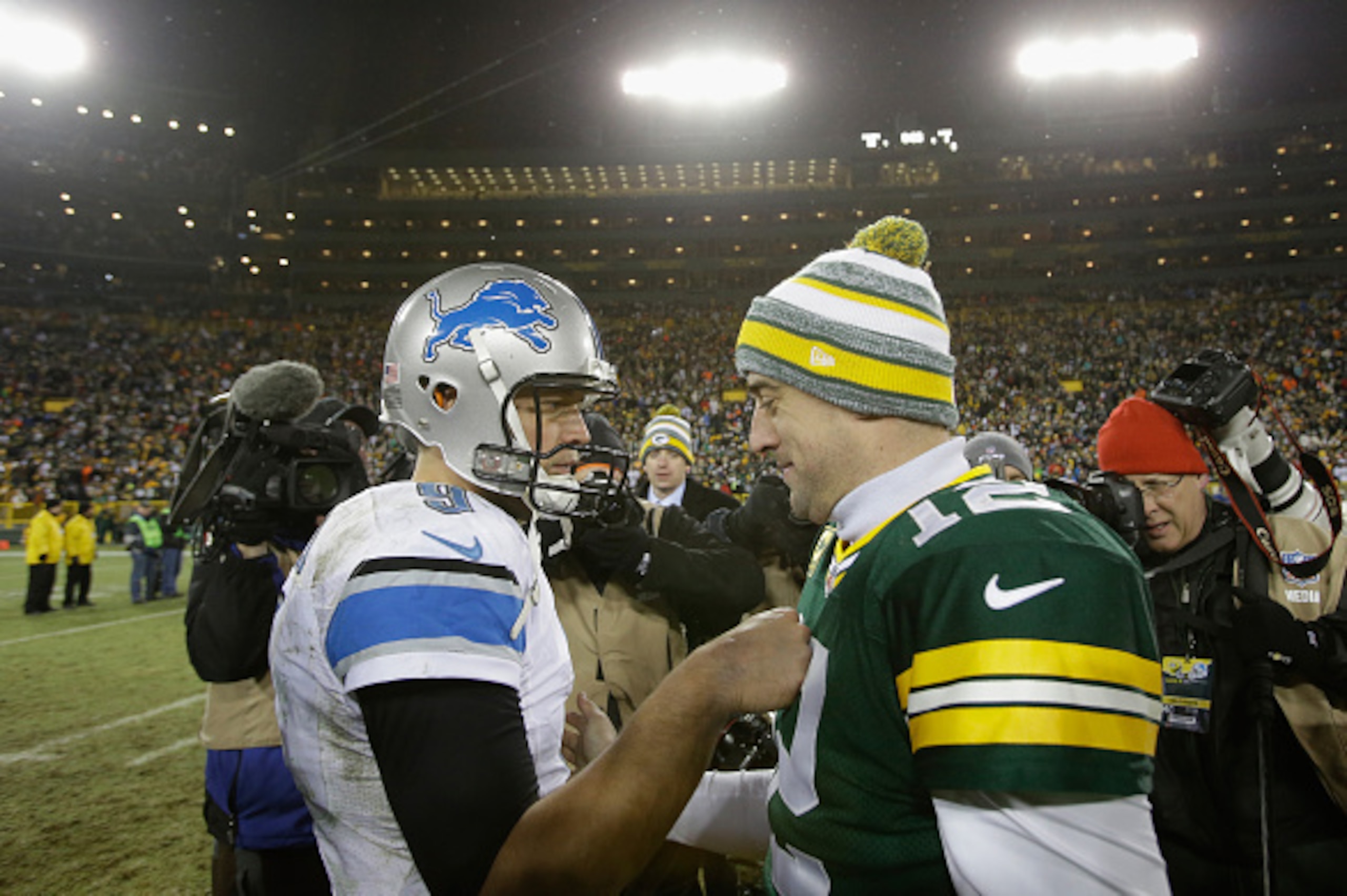 GREEN BAY, WI - DECEMBER 28: Quarterbacks Matthew Stafford #9 of the Detroit Lions and Aaron Rodgers #12 of the Green Bay Packers shake hands after the Packers defeated the Lions 30-20 during the NFL game at Lambeau Field on December 28, 2014 in Green GREEN BAY, WI - DECEMBER 28: Quarterbacks Matthew Stafford #9 of the Detroit Lions and Aaron Rodgers #12 of the Green Bay Packers shake hands after the Packers defeated the Lions 30-20 during the NFL game at Lambeau Field on December 28, 2014 in Green