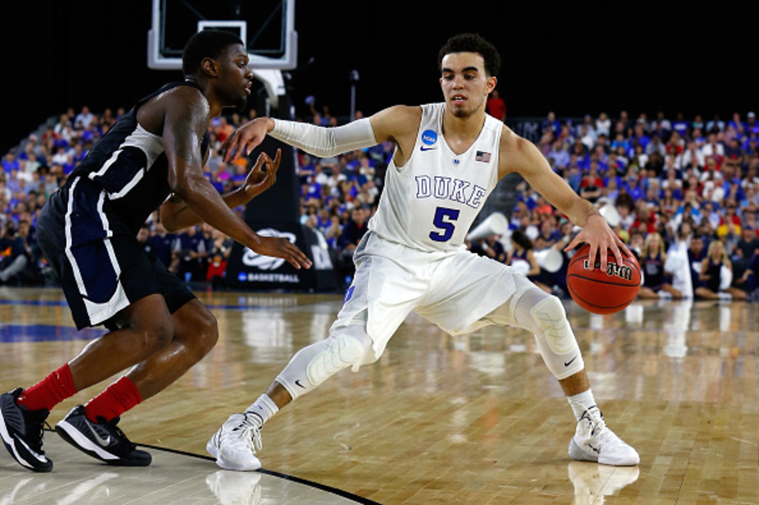HOUSTON, TX - MARCH 29:  Tyus Jones #5 of the Duke Blue Devils goes to the basket against Gary Bell Jr. #5 of the Gonzaga Bulldogs during the South Regional Final of the 2015 NCAA Men's Basketball Tournament at NRG Stadium on March 29, 2015 in Houston, Te
