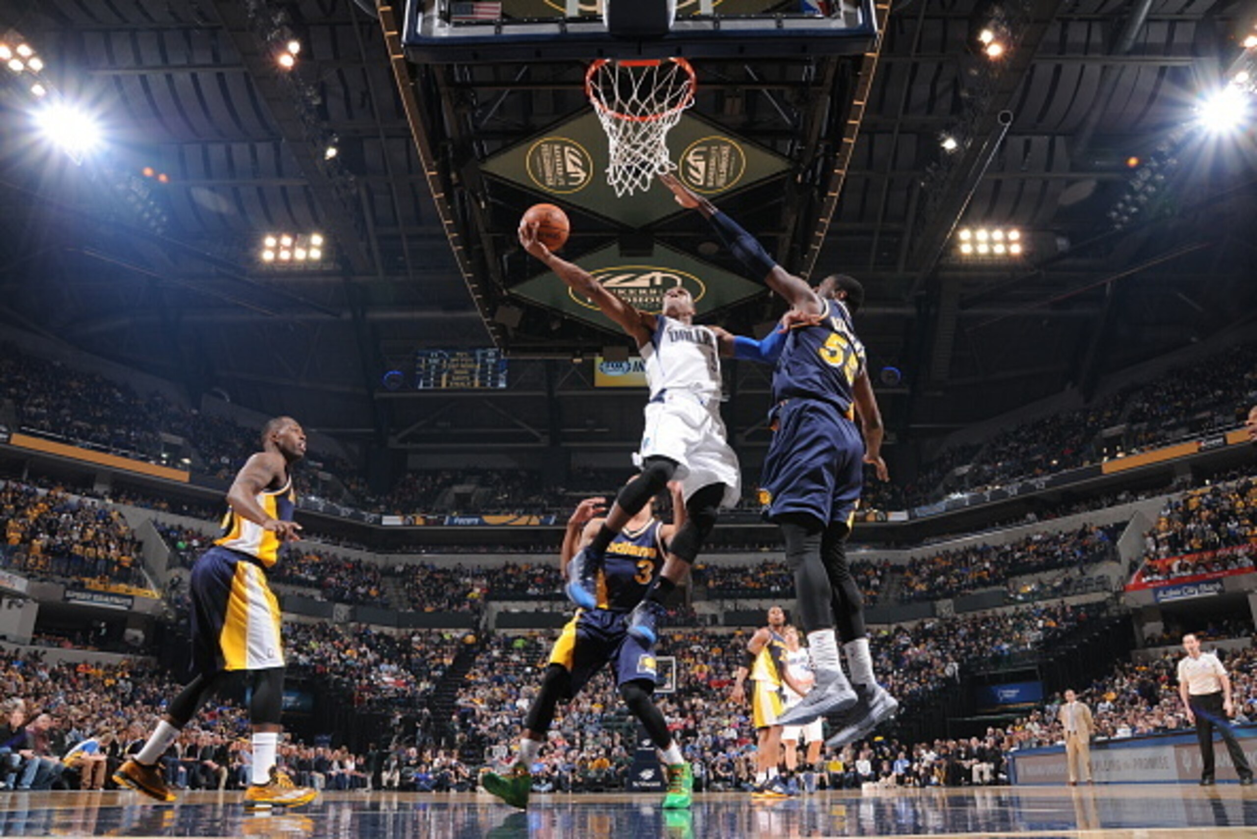 INDIANAPOLIS, IN - MARCH 29:  Rajon Rondo #9 of the Dallas Mavericks goes to the basket against Roy Hibbert #55 of the Indiana Pacers on March 29, 2015 at Bankers Life Fieldhouse in Indianapolis, Indiana.  NOTE TO USER: User expressly acknowledges and agr