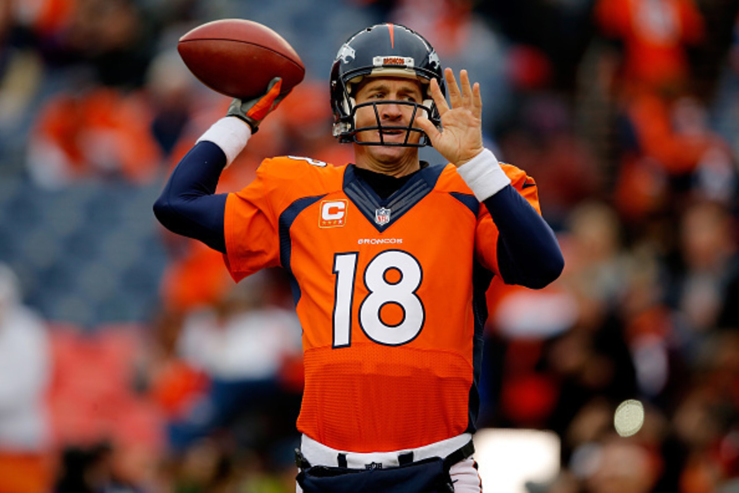 DENVER, CO - JANUARY 11:  Peyton Manning #18 of the Denver Broncos warms up prior to a 2015 AFC Divisional Playoff game against the Indianapolis Colts at Sports Authority Field at Mile High on January 11, 2015 in Denver, Colorado.  (Photo by Doug Pensinge