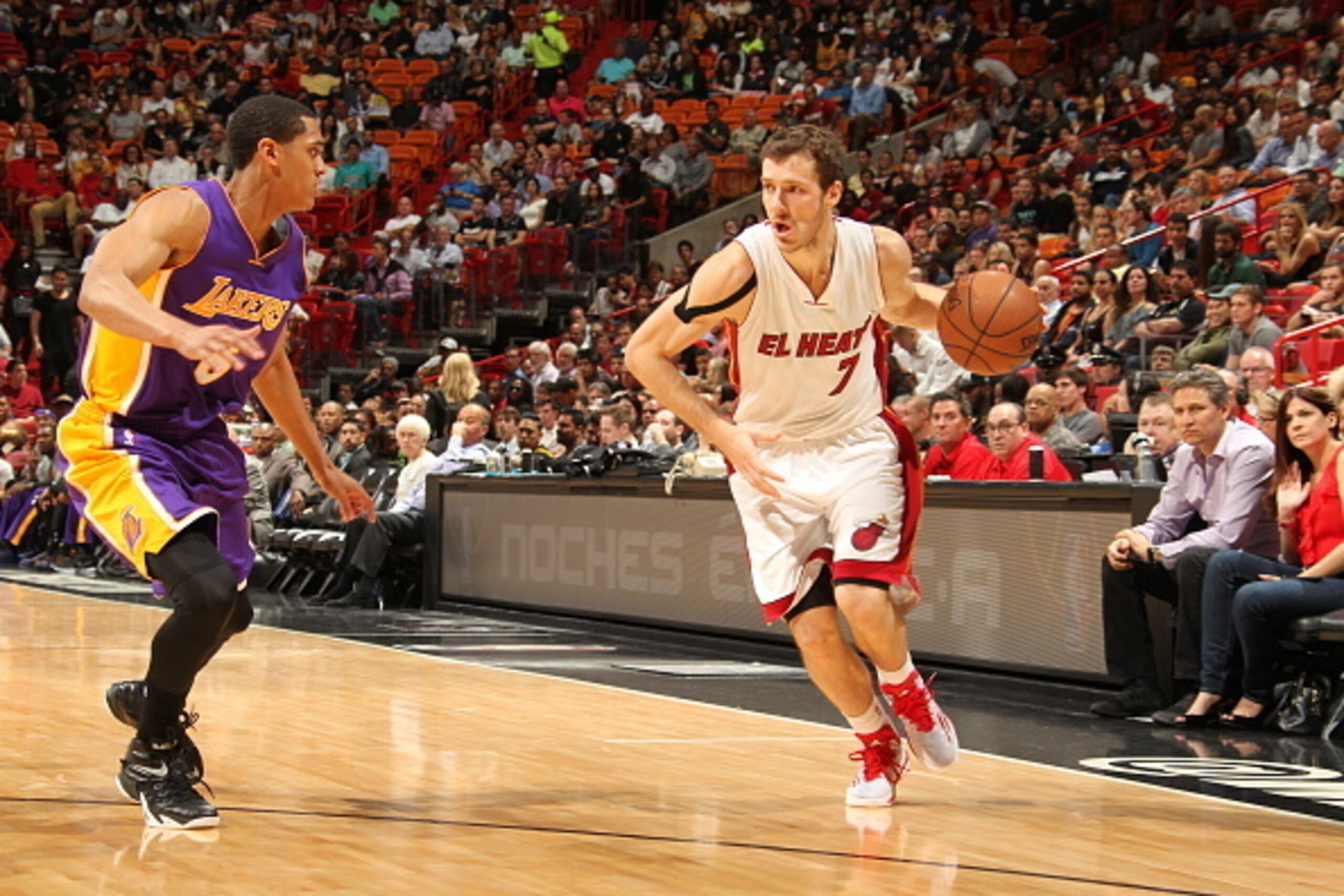 MIAMI, FL - MARCH 4:  Goran Dragic #7 of the Miami Heat drives to the basket against Jordan Clarkson #6 of the Los Angeles Lakers on March 4, 2015 at American Airlines Arena in Miami, Florida.  NOTE TO USER: User expressly acknowledges and agrees that, by