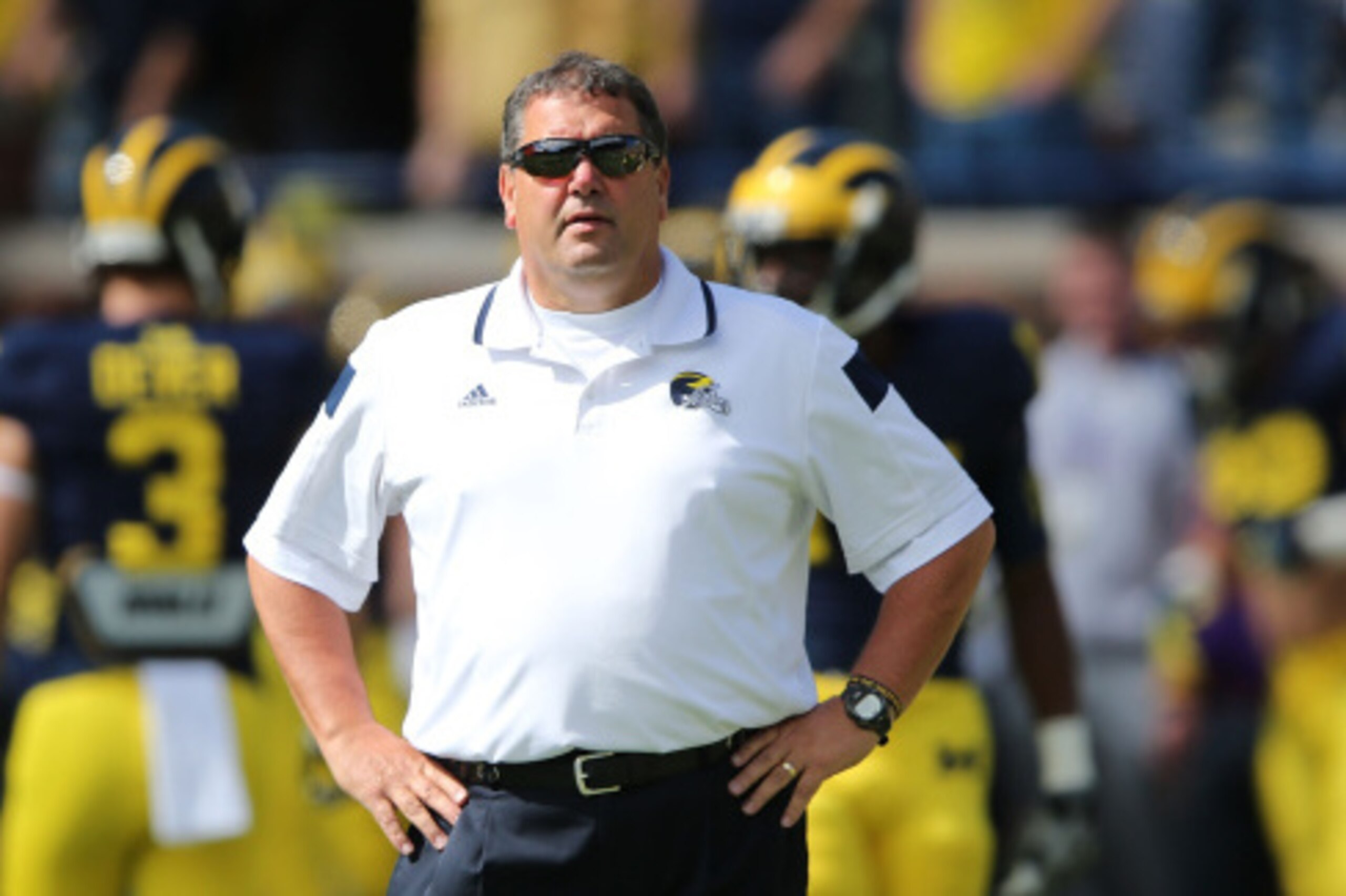 ANN ARBOR, MI - SEPTEMBER 13:  Head Football Coach Brady Hoke watches the warms up prior to the start of the game between the Miami University Redhawks and the Michigan Wolverines at Michigan Stadium on September 13, 2014 in Ann Arbor, Michigan. the Wolve