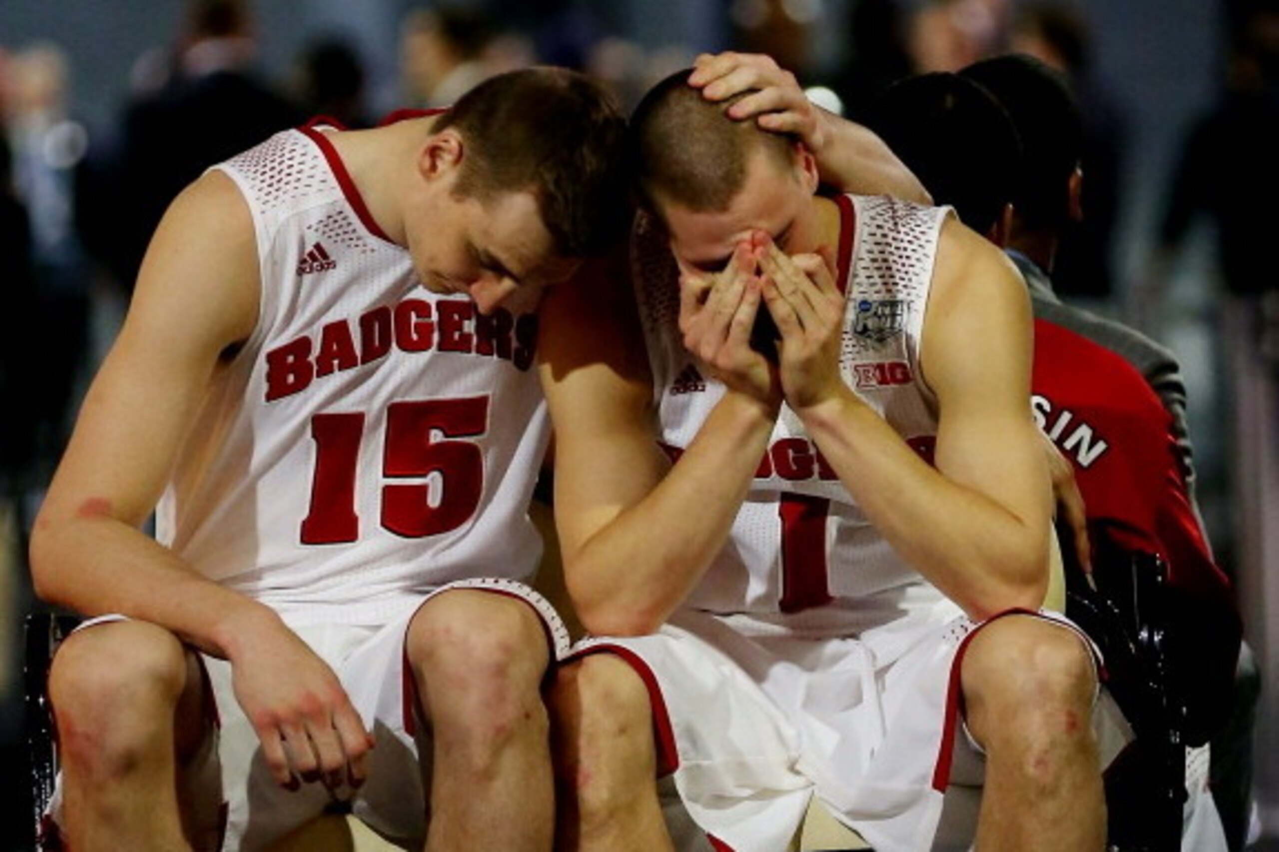 ARLINGTON, TX - APRIL 05: Sam Dekker #15 and Ben Brust #1 of the Wisconsin Badgers react after losing to the Kentucky Wildcats 74-73 in the NCAA Men's Final Four Semifinal at AT&T Stadium on April 5, 2014 in Arlington, Texas. (Photo by Ronald Martinez/Ge ARLINGTON, TX - APRIL 05: Sam Dekker #15 and Ben Brust #1 of the Wisconsin Badgers react after losing to the Kentucky Wildcats 74-73 in the NCAA Men's Final Four Semifinal at AT&T Stadium on April 5, 2014 in Arlington, Texas. (Photo by Ronald Martinez/Ge