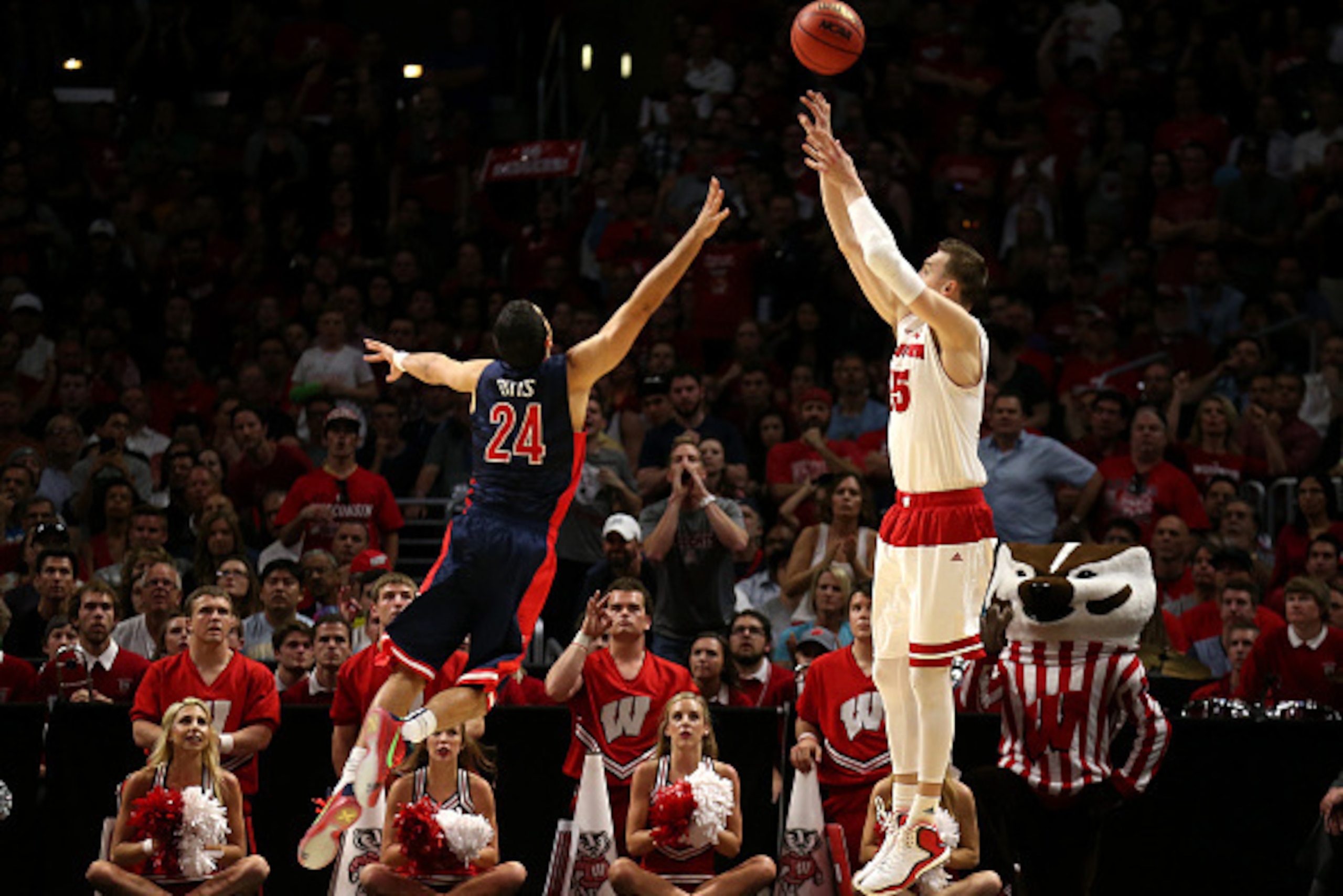 LOS ANGELES, CA - MARCH 28: Sam Dekker #15 of the Wisconsin Badgers makes a three-pointer over Elliott Pitts #24 of the Arizona Wildcats in the second half during the West Regional Final of the 2015 NCAA Men's Basketball Tournament at Staples Center on M LOS ANGELES, CA - MARCH 28: Sam Dekker #15 of the Wisconsin Badgers makes a three-pointer over Elliott Pitts #24 of the Arizona Wildcats in the second half during the West Regional Final of the 2015 NCAA Men's Basketball Tournament at Staples Center on M
