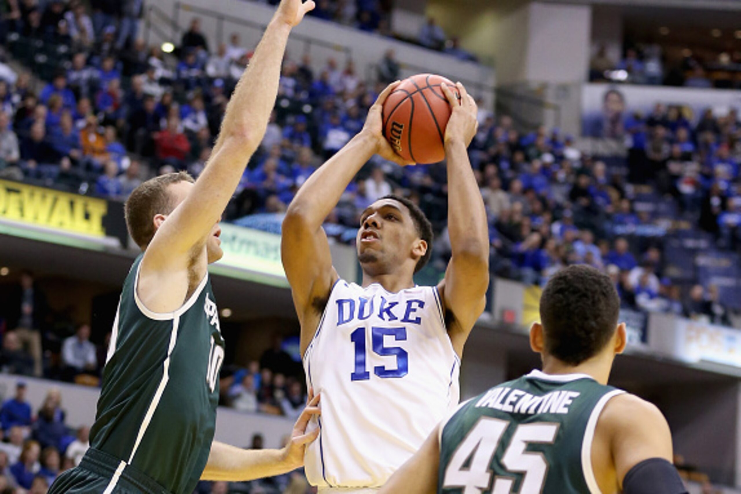 INDIANAPOLIS, IN - NOVEMBER 18: Jahlil Okafor #15 of the Duke Blue Devils shoots the ball during the game against the Michigan State Spartans in the State Farm Champions Classic at Bankers Life Fieldhouse on November 18, 2014 in Indianapolis, Indiana. ( INDIANAPOLIS, IN - NOVEMBER 18: Jahlil Okafor #15 of the Duke Blue Devils shoots the ball during the game against the Michigan State Spartans in the State Farm Champions Classic at Bankers Life Fieldhouse on November 18, 2014 in Indianapolis, Indiana. (