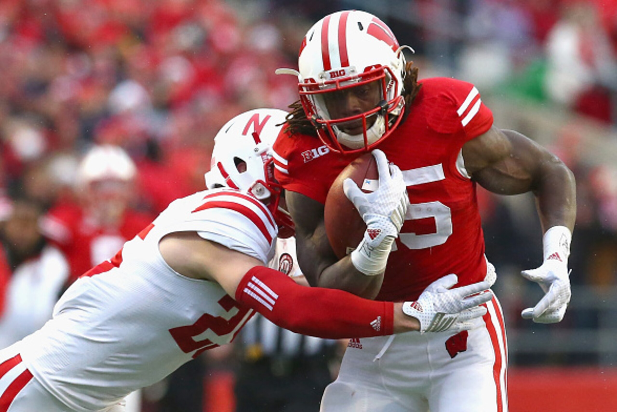 MADISON, WI - NOVEMBER 15:  Melvin Gordon #25 of the Wisconsin Badgers runs the ball against Nate Gerry #25 of the Nebraska Cornhuskers at Camp Randall Stadium on November 15, 2014 in Madison, Wisconsin.  (Photo by Ronald Martinez/Getty Images)