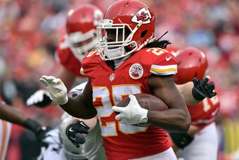 KANSAS CITY, MO - DECEMBER 14:   Jamaal Charles #25 of the Kansas City Chiefs runs the ball against the Oakland Raiders during the first half at Arrowhead Stadium on December 14, 2014 in Kansas City, Missouri.  (Photo by Peter Aiken/Getty Images)