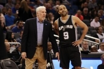 Apr 1, 2015; Orlando, FL, USA; San Antonio Spurs head coach Gregg Popovich and guard Tony Parker (9) talk against the Orlando Magic during the second half at Amway Center. San Antonio Spurs defeated the Orlando Magic 103-91. Mandatory Credit: Kim Klement- Apr 1, 2015; Orlando, FL, USA; San Antonio Spurs head coach Gregg Popovich and guard Tony Parker (9) talk against the Orlando Magic during the second half at Amway Center. San Antonio Spurs defeated the Orlando Magic 103-91. Mandatory Credit: Kim Klement-