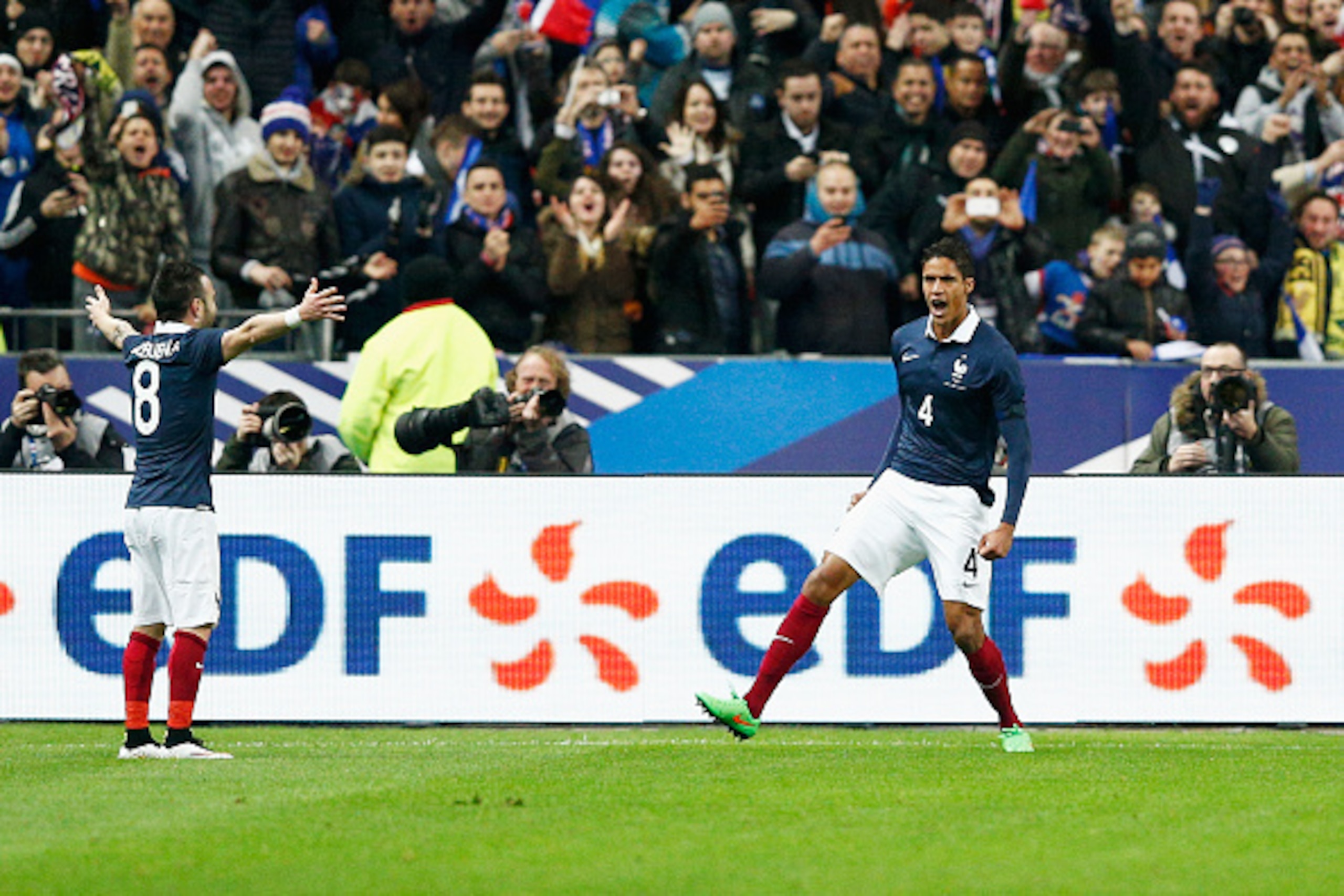 PARIS, FRANCE - MARCH 26:  Raphael Varane #4 of France celebrates with team mates after scoring the first goal of the game during the International Friendly match between France and Brazil at the Stade de France on March 26, 2015 in Paris, France.  (Photo