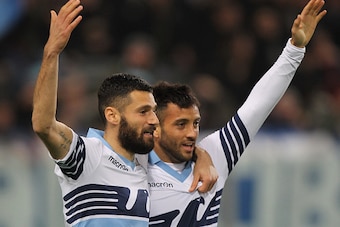 ROME, ITALY - MARCH 22:  Felipe Anderson with his teammate Antonio Candreva (L) of SS Lazio celebrates after scoring the opening goal during the Serie A match between SS Lazio and Hellas Verona FC at Stadio Olimpico on March 22, 2015 in Rome, Italy.  (Pho
