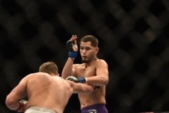 July 26, 2014; San Jose, CA, USA; Jorge Masvidal (blue gloves) fights Daron Cruickshank (red gloves) during the lightweight bout of the FOX UFC Saturday at SAP Center. Mandatory Credit: Kyle Terada-USA TODAY Sports