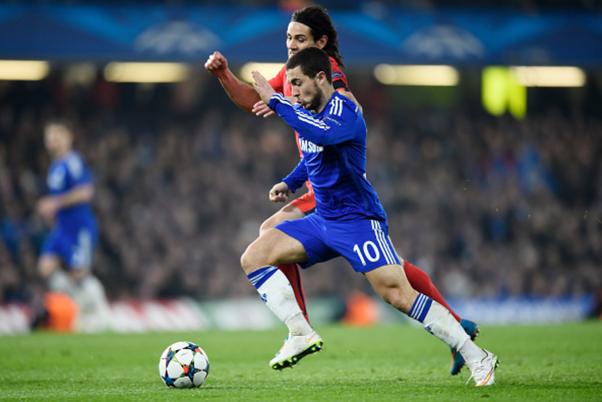 LONDON, ENGLAND - MARCH 11:  Eden Hazard of Chelsea is challenged by Edinson Cavani of PSG during the UEFA Champions League Round of 16, second leg match between Chelsea and Paris Saint-Germain at Stamford Bridge on March 11, 2015 in London, England.  (Ph