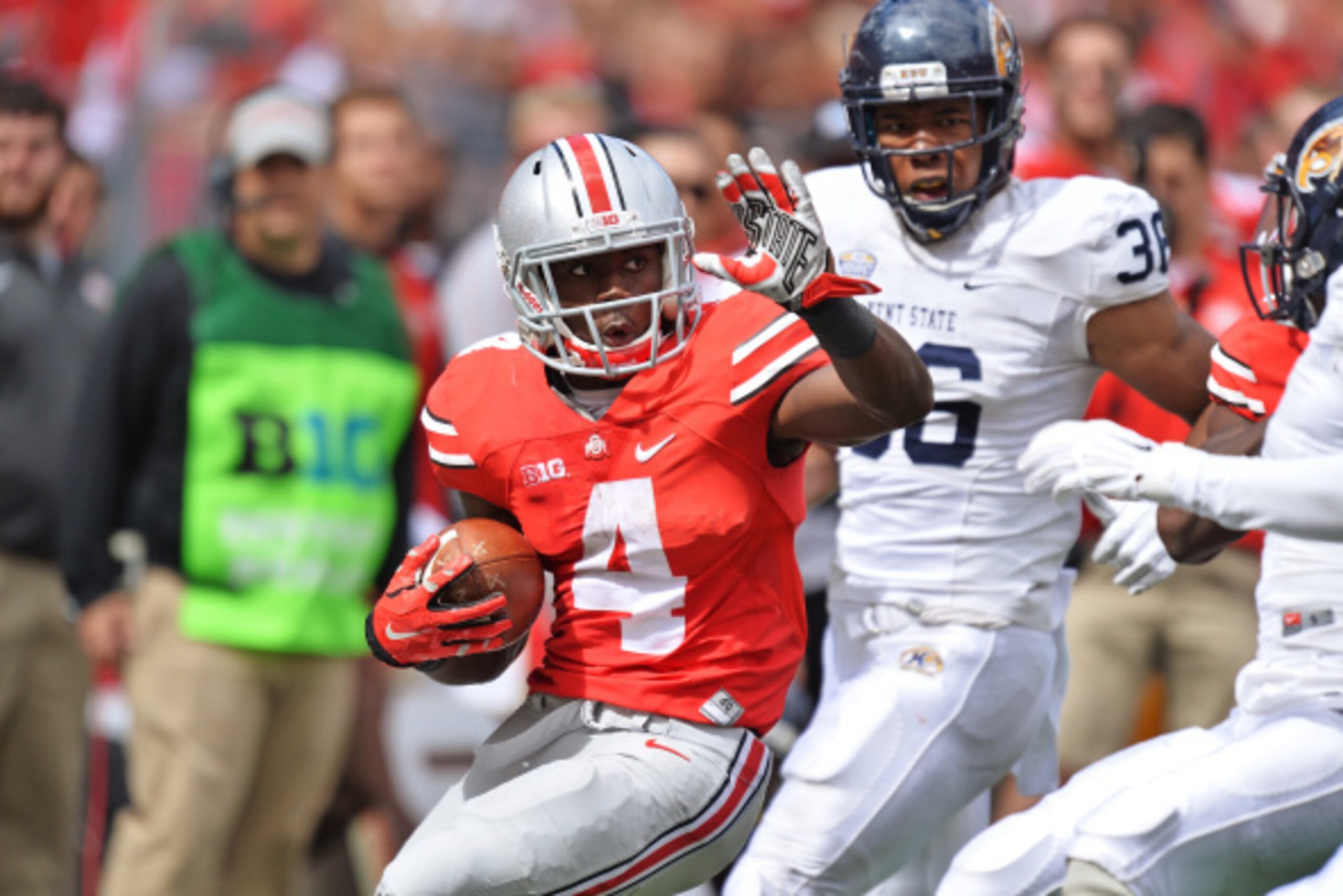 COLUMBUS, OH - SEPTEMBER 13: Curtis Samuel #4 of the Ohio State Buckeyes looks for running room in the fourth quarter against the Kent State Golden Flashes at Ohio Stadium on September 13, 2014 in Columbus, Ohio. Ohio State defeated Kent State 66-0. (Ph COLUMBUS, OH - SEPTEMBER 13: Curtis Samuel #4 of the Ohio State Buckeyes looks for running room in the fourth quarter against the Kent State Golden Flashes at Ohio Stadium on September 13, 2014 in Columbus, Ohio. Ohio State defeated Kent State 66-0. (Ph