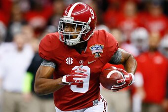 NEW ORLEANS, LA - JANUARY 01:  Amari Cooper #9 of the Alabama Crimson Tide runs the ball in the first quarter against the Ohio State Buckeyes during the All State Sugar Bowl at the Mercedes-Benz Superdome on January 1, 2015 in New Orleans, Louisiana.  (Ph
