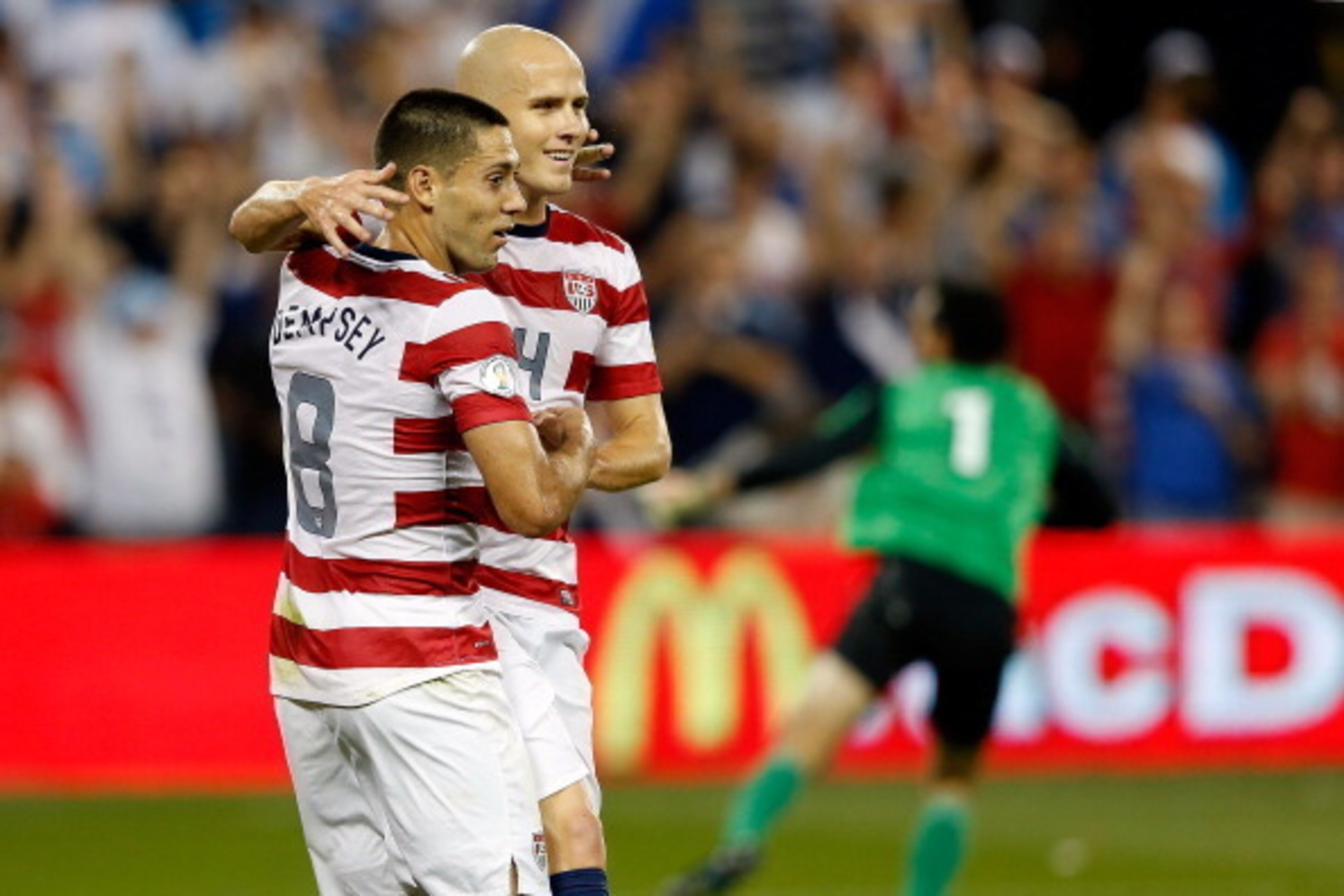 KANSAS CITY, KS - OCTOBER 16:  Michael Bradley #4 of the USA congratulates Clint Dempsey #8 after Dempsey scored a goal during the first half fo the World Cup Qualifying match against Guatemala at LiveStrong Sporting Park on October 16, 2012 in Kansas Cit