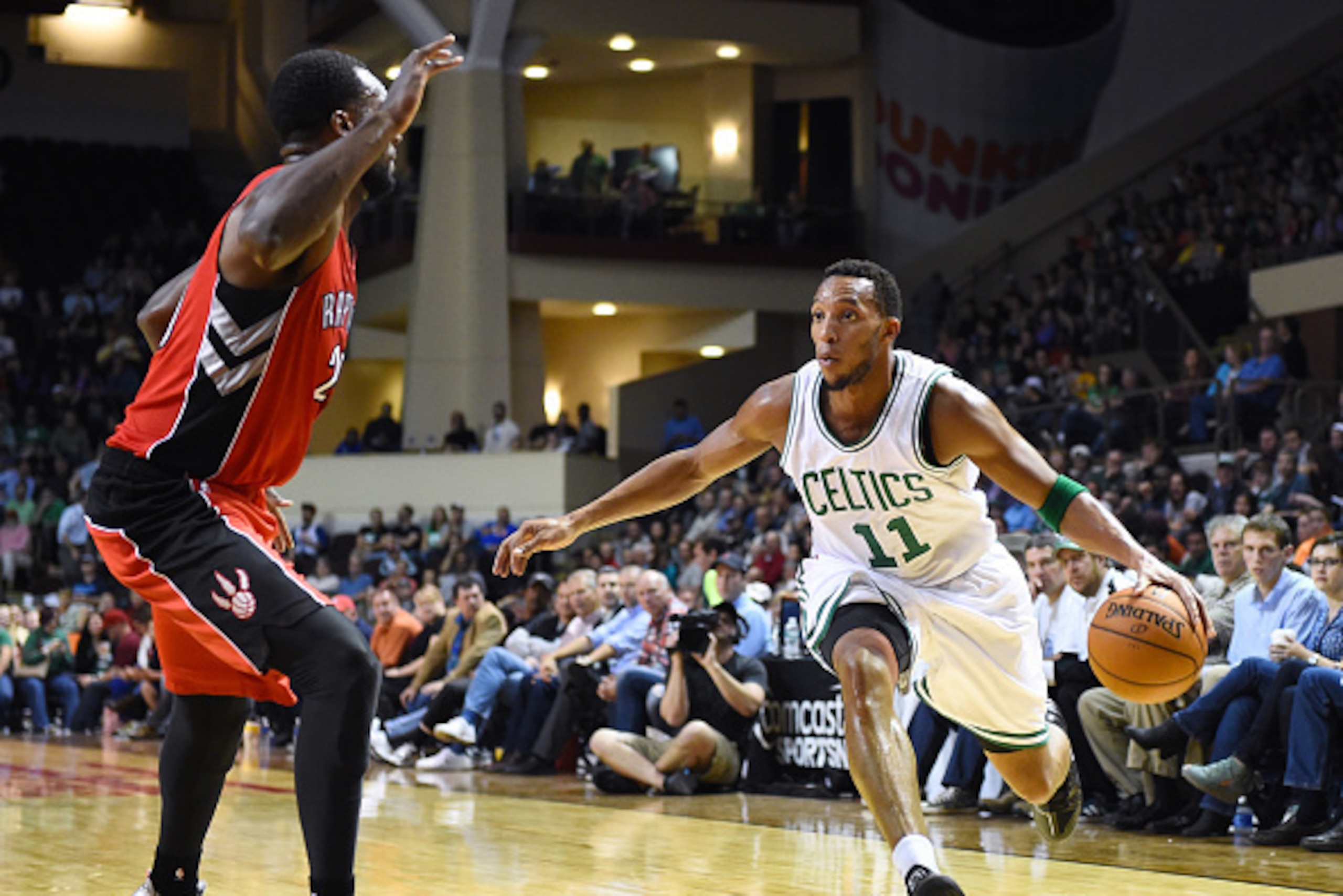 PORTLAND, ME - OCTOBER 15: Evan Turner #11 of the Boston Celtics drives to basket against the Toronto Raptors on October 15, 2014 at the Cross Insurance Arena in Portland, Maine. NOTE TO USER: User expressly acknowledges and agrees that, by downloading an