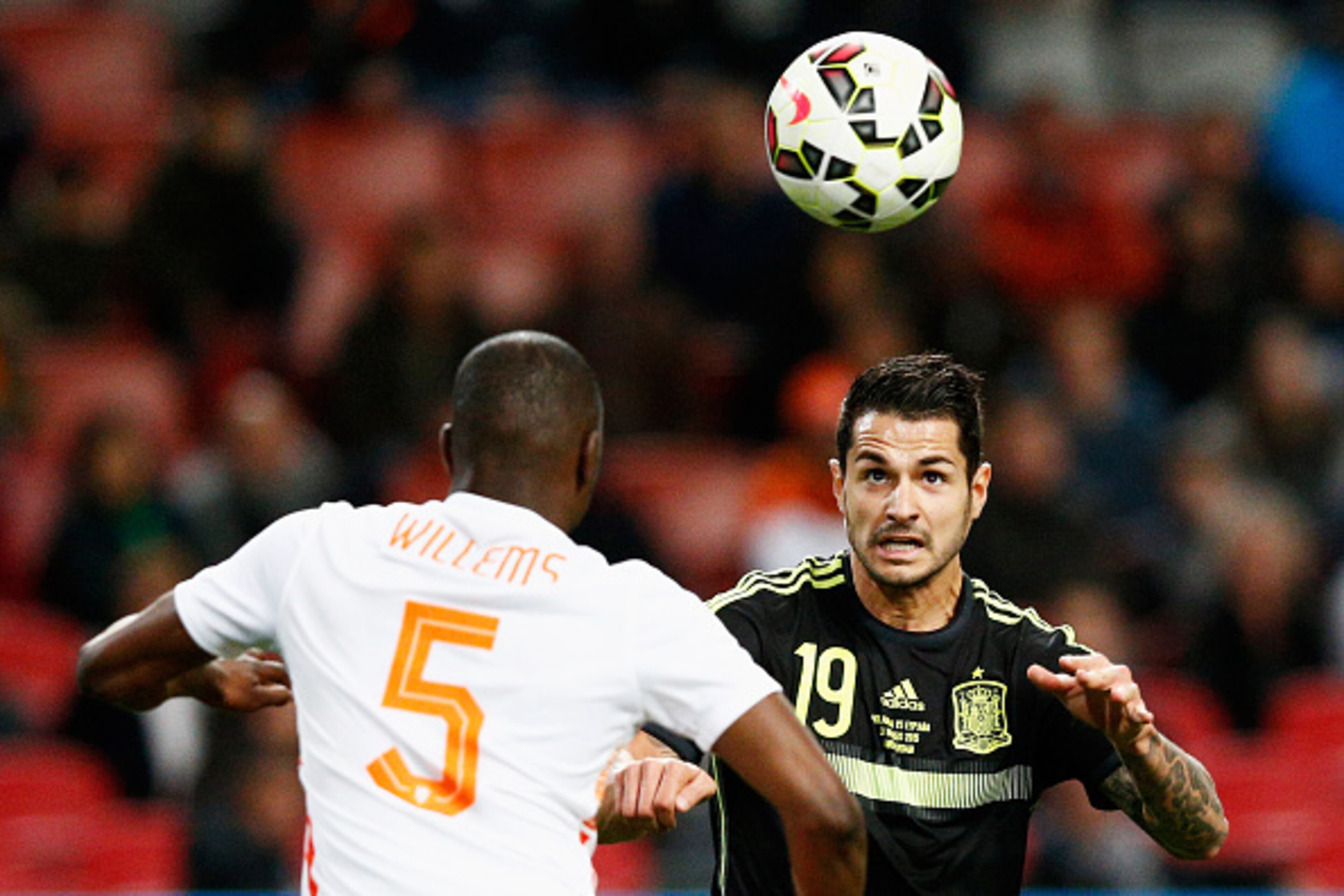 AMSTERDAM, NETHERLANDS - MARCH 31:  Jetro Willems of Netherlands attempts to stop Vitolo of Spain from heading the ball on goal during the international friendly match between the Netherlands and Spain held at Amsterdam Arena on March 31, 2015 in Amsterda
