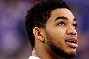 INDIANAPOLIS, IN - APRIL 03: Karl-Anthony Towns #12 of the Kentucky Wildcats looks on during practice for the NCAA Men's Final Four at Lucas Oil Stadium on April 3, 2015 in Indianapolis, Indiana.  (Photo by Andy Lyons/Getty Images)