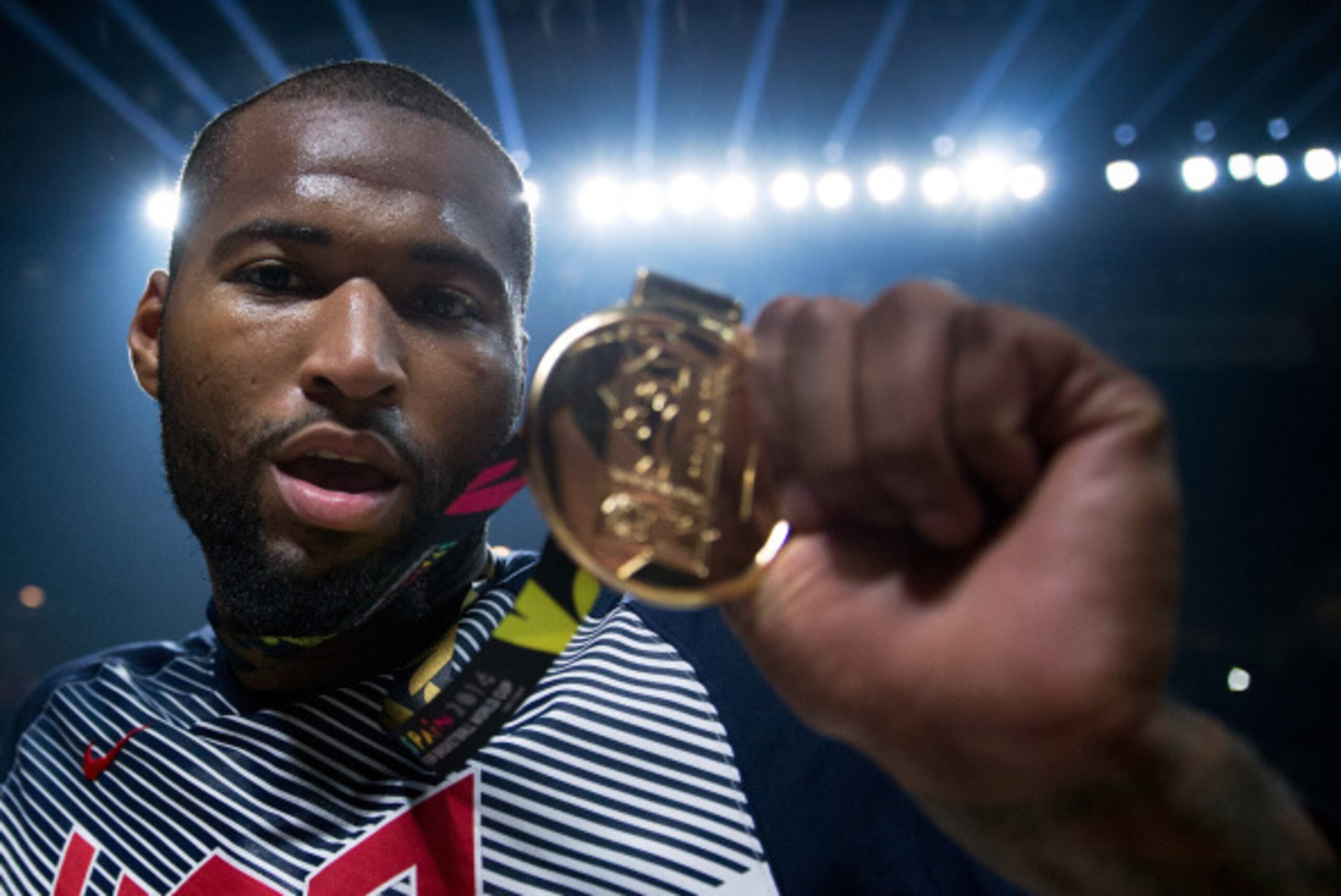 MADRID, SPAIN - SEPTEMBER 14: DeMarcus Cousins of the USA shows off his gold medal after Team USA defeats Serbia in the 2014 FIBA World Basketball Championship final match between USA and Serbia at Palacio de los Deportes on September 14, 2014 in Madrid, 