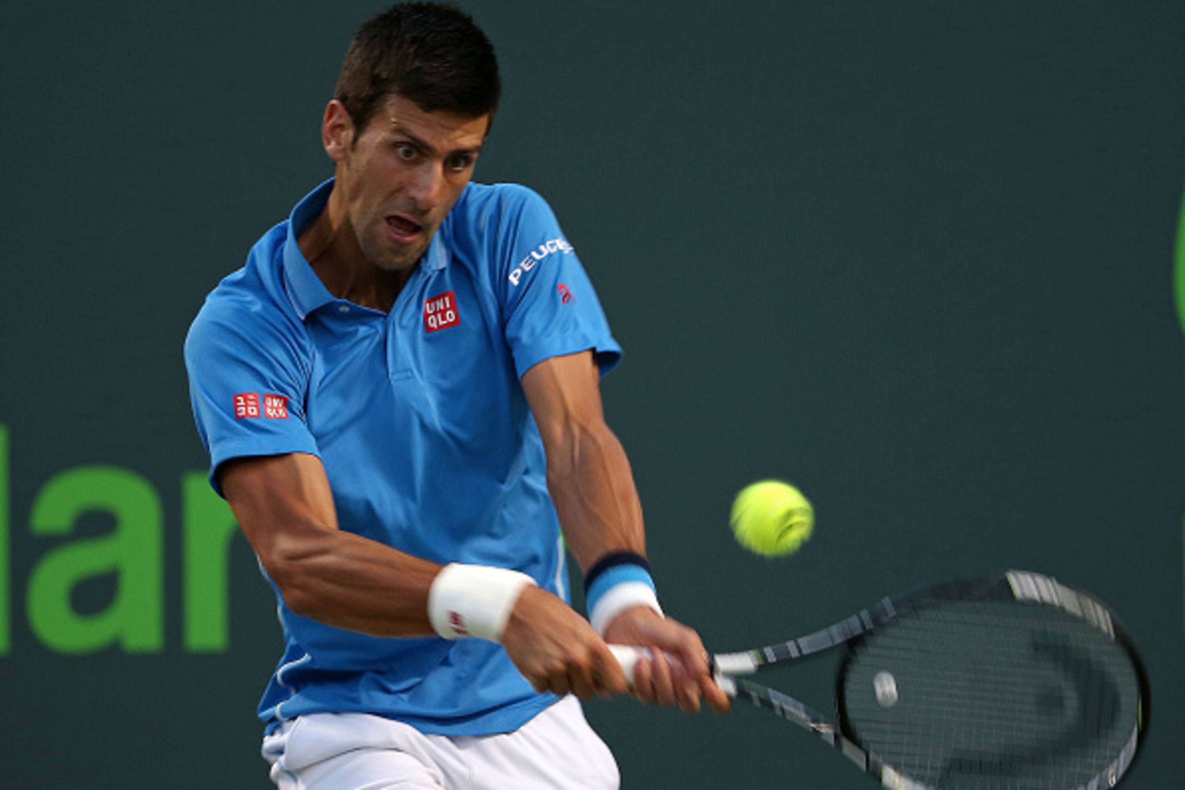 KEY BISCAYNE, FL - APRIL 03:  Novak Djokovic of Serbia plays a semifinal match against John Isner during Day 12 of the Miami Open presented by Itau at Crandon Park Tennis Center on April 3, 2015 in Key Biscayne, Florida.  (Photo by Mike Ehrmann/Getty Imag