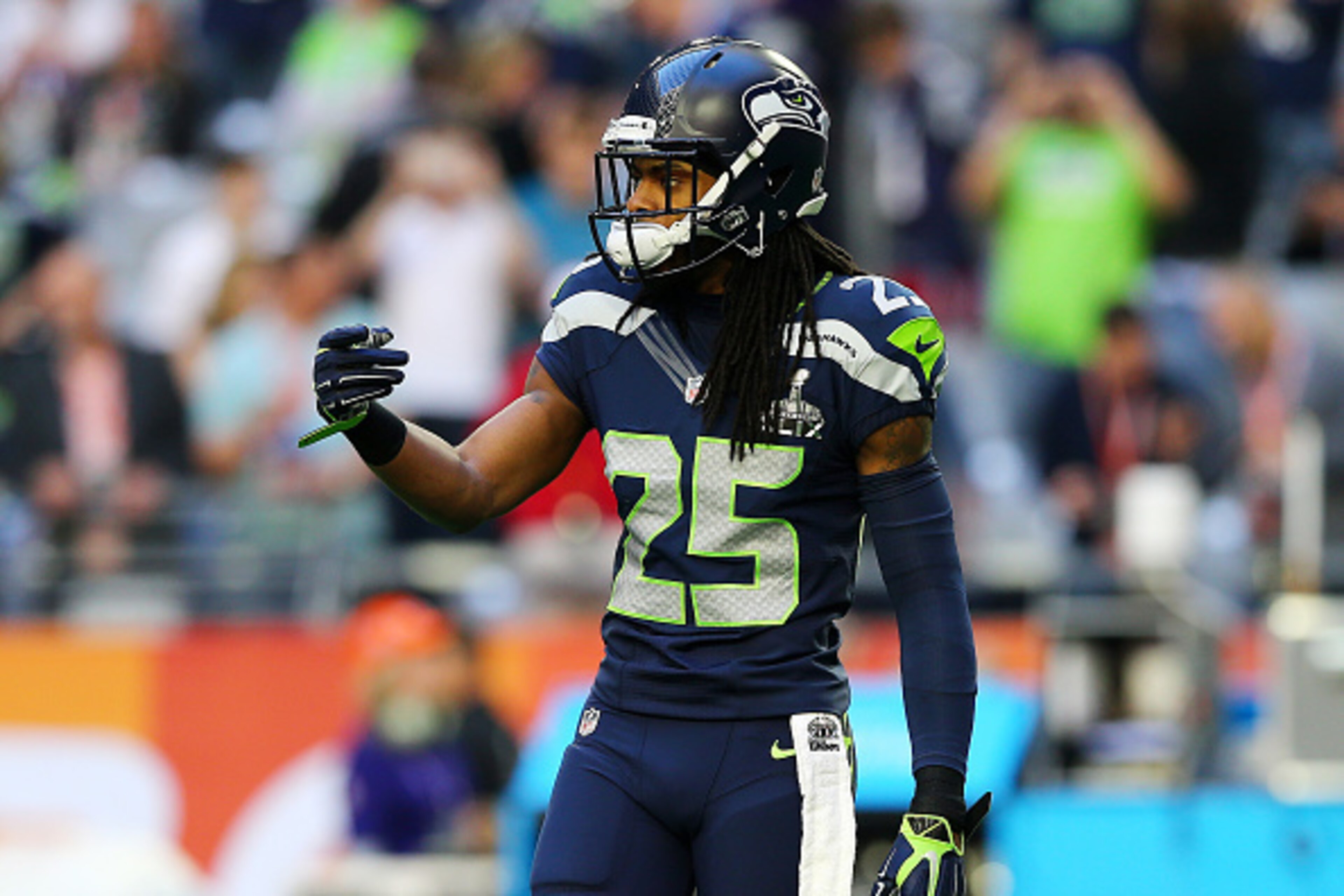GLENDALE, AZ - FEBRUARY 01:  Richard Sherman #25 of the Seattle Seahawks  warms up prior to playing in Super Bowl XLIX at University of Phoenix Stadium on February 1, 2015 in Glendale, Arizona.  (Photo by Elsa/Getty Images)