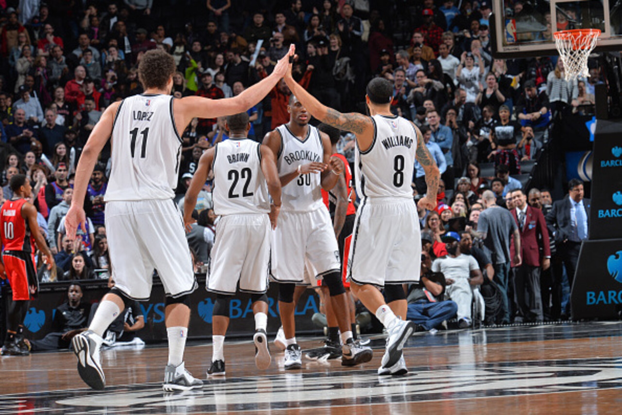 BROOKLYN,NY - APRIL 3: Brook Lopez #11 and Deron Williams #8 of the Brooklyn Nets give each other high fives after the WIN against the Toronto Raptors at Barclays Center on April 3, 2015 in Brooklyn, New York NOTE TO USER: User expressly acknowledges and BROOKLYN,NY - APRIL 3: Brook Lopez #11 and Deron Williams #8 of the Brooklyn Nets give each other high fives after the WIN against the Toronto Raptors at Barclays Center on April 3, 2015 in Brooklyn, New York NOTE TO USER: User expressly acknowledges and