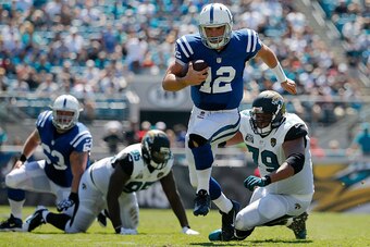 JACKSONVILLE, FL - SEPTEMBER 21: Andrew Luck #12 of the Indianapolis Colts carries during the second quarter of the game at EverBank Field on September 21, 2014 in Jacksonville, Florida.  (Photo by Rob Foldy/Getty Images)