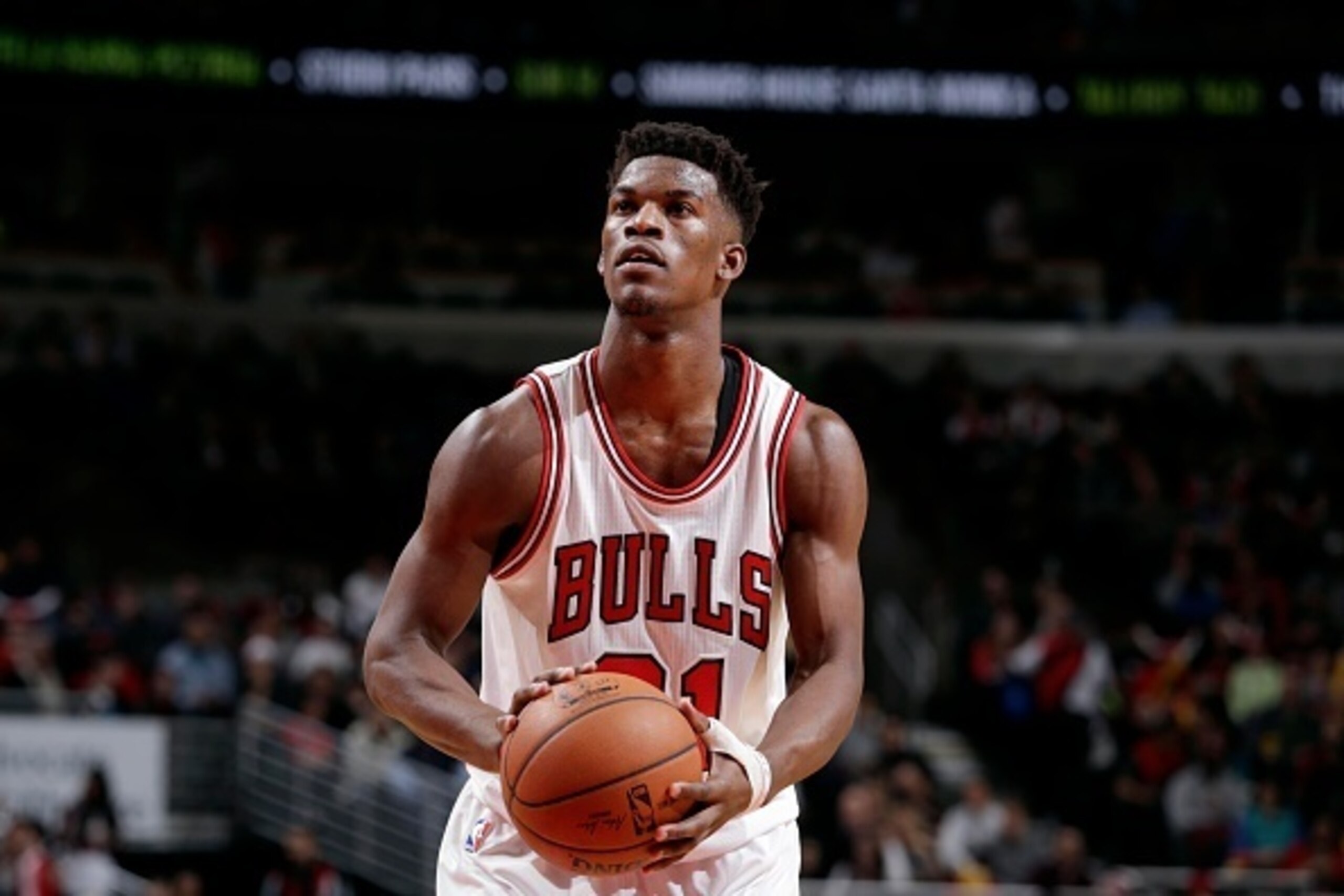 CHICAGO, IL - FEBRUARY 25: Jimmy Butler #21 of the Chicago Bulls attempts a free throw against  the Charlotte Hornets on February 25, 2015 at the United Center in Chicago, Illinois. NOTE TO USER: User expressly acknowledges and agrees that, by downloading