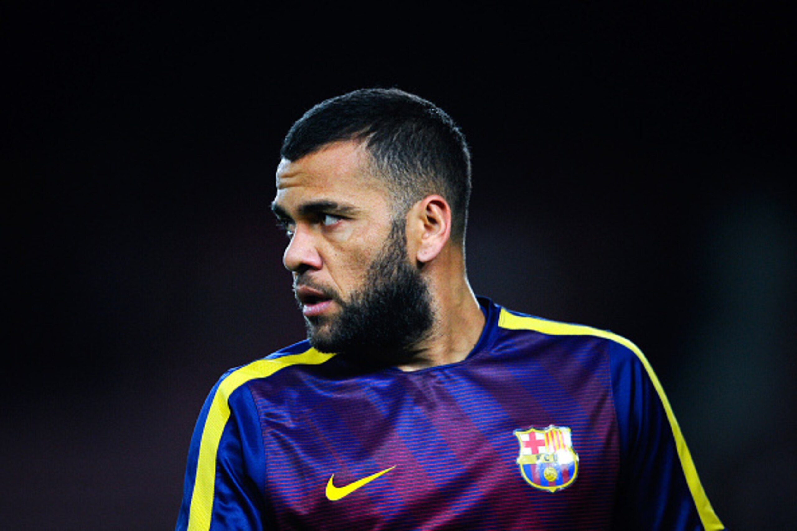 BARCELONA, SPAIN - FEBRUARY 11:  Dani Alves of FC Barcelona looks on during the warm up prior to the Copa del Rey Semi-Final first leg match between FC Barcelona and Villarreal CF at Camp Nou on February 11, 2015 in Barcelona, Spain.  (Photo by David Ramo