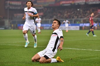 GENOA, ITALY - NOVEMBER 24:  Paulo Dybala (R) of US Citta di Palermo celebrates after scoring the opening goal during the Serie A match between Genoa CFC and US Citta di Palermo at Stadio Luigi Ferraris on November 24, 2014 in Genoa, Italy.  (Photo by Val