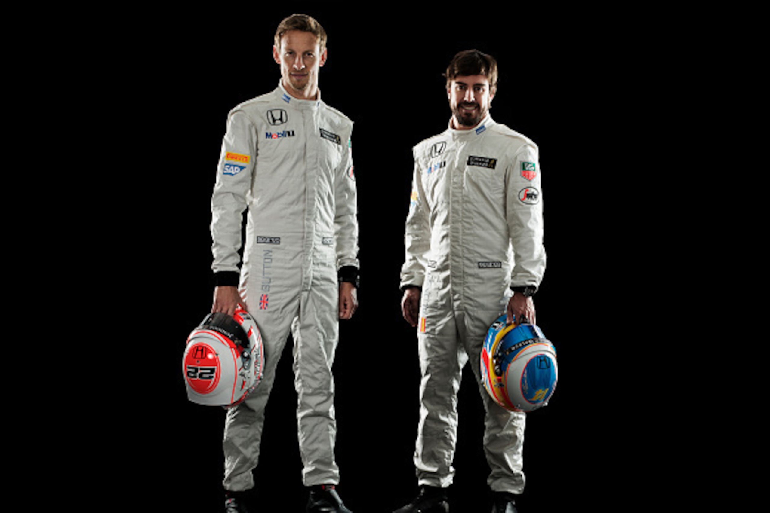 WOKING, ENGLAND - JANUARY 29: This handout image supplied by McLaren-Honda shows   McLaren-Honda drivers Jenson Button (l) and Fernando Alonso (r) during the launch of the car on January 29, 2015 in Woking, England.  (Photo by Handout/Getty Images)