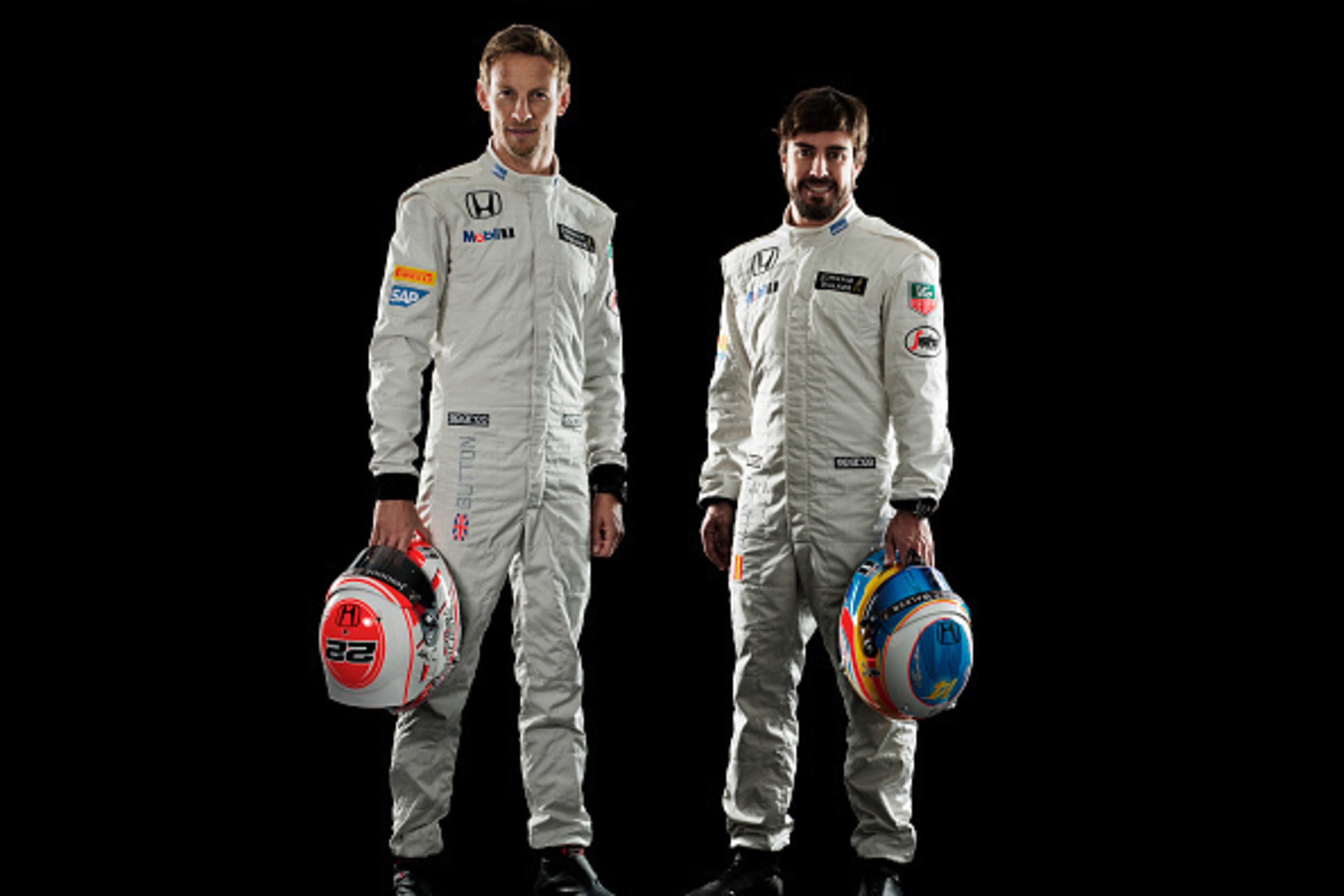 WOKING, ENGLAND - JANUARY 29: This handout image supplied by McLaren-Honda shows McLaren-Honda drivers Jenson Button (l) and Fernando Alonso (r) during the launch of the car on January 29, 2015 in Woking, England. (Photo by Handout/Getty Images) WOKING, ENGLAND - JANUARY 29: This handout image supplied by McLaren-Honda shows McLaren-Honda drivers Jenson Button (l) and Fernando Alonso (r) during the launch of the car on January 29, 2015 in Woking, England. (Photo by Handout/Getty Images)